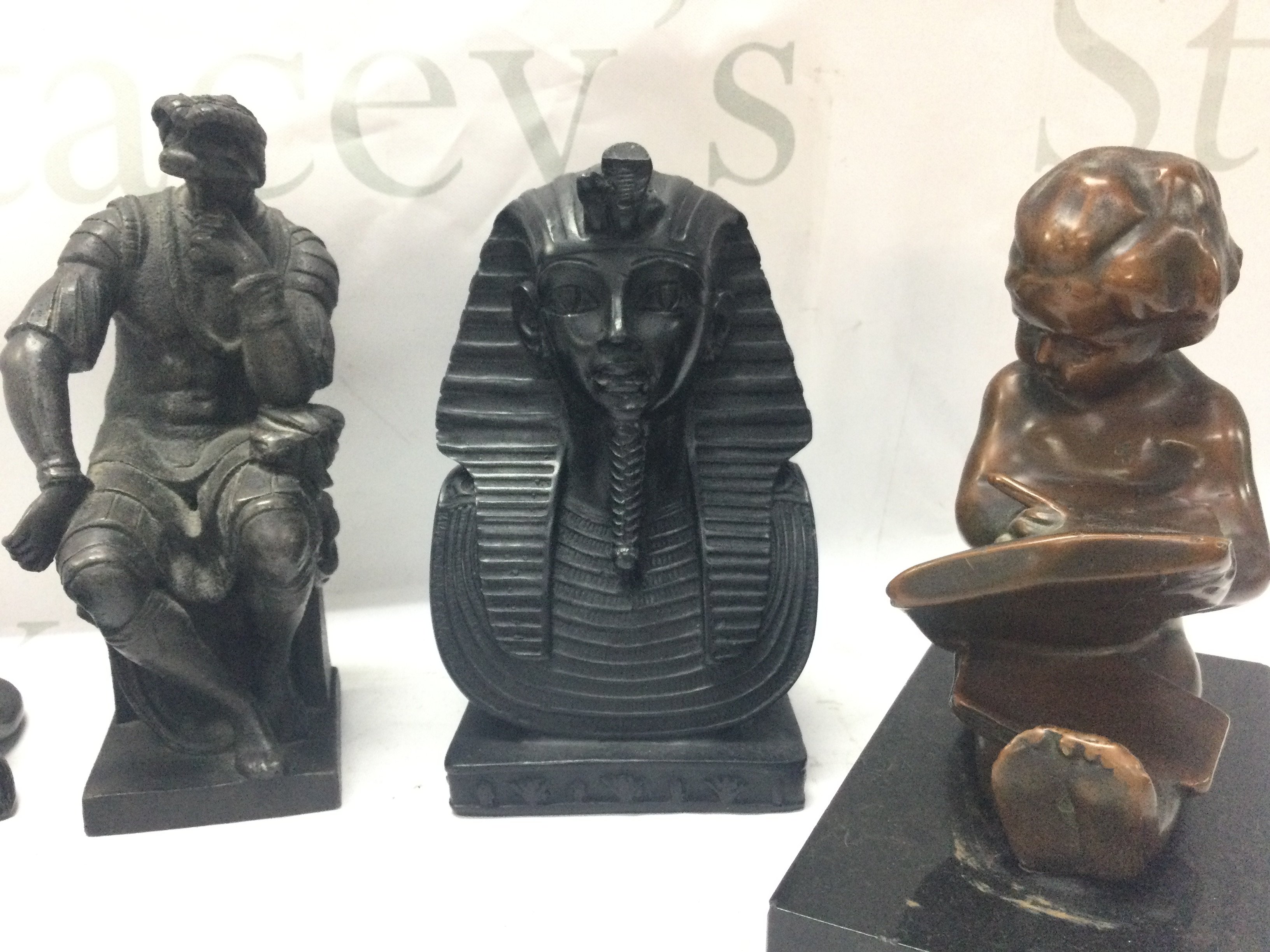 A Tutankhamen bust, lion figure, child reading book , Lorenzo di Piero de Medici figure, bronze figures desk seals. Postage category C- NO RESERVE