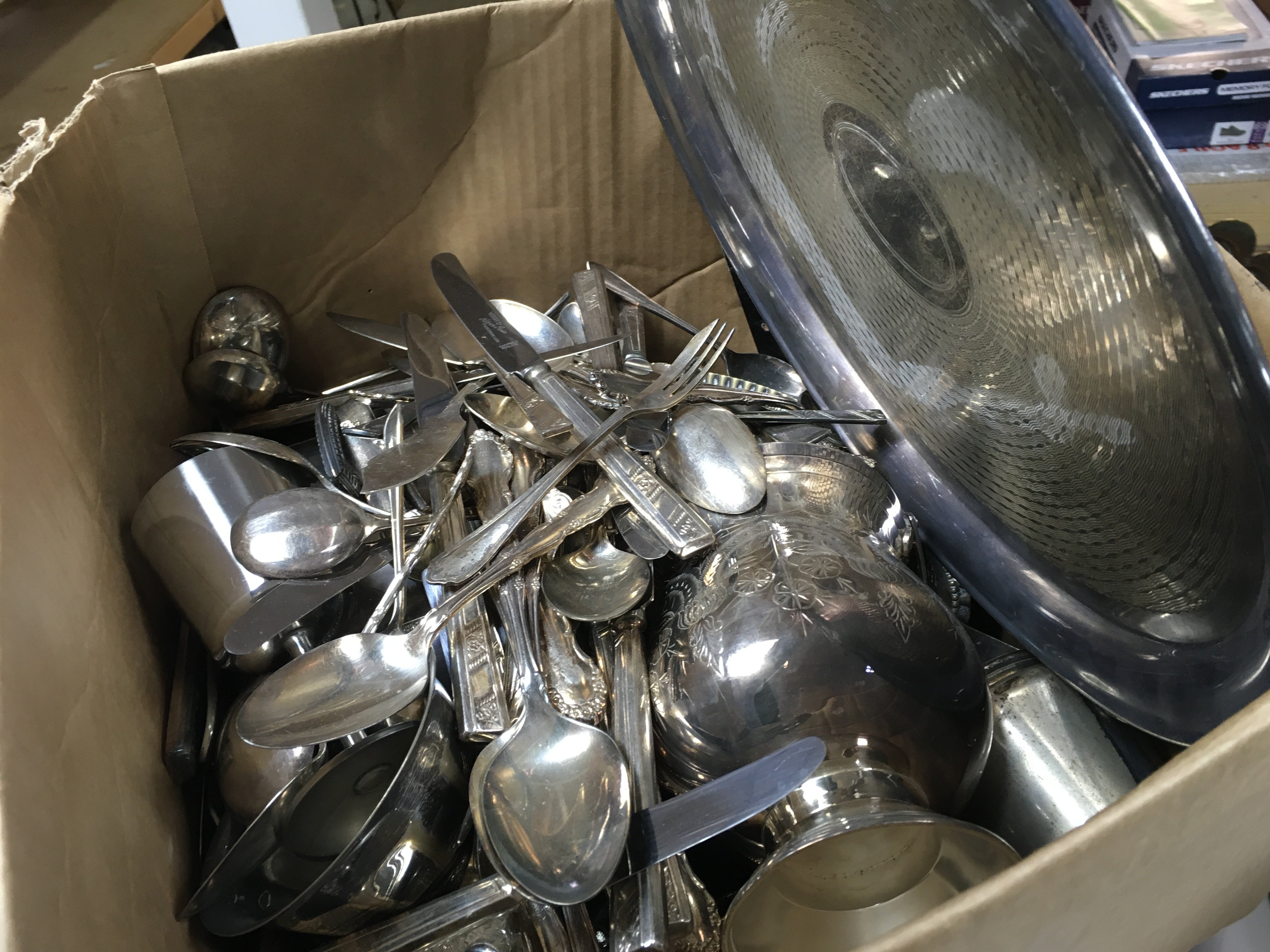 A Collection of silver plated items including a large collection of cutlery, a cut glass claret jug, candlestick, stainless steel goblet etc and a vintage Cosina PM1 camera . This lot cannot be posted