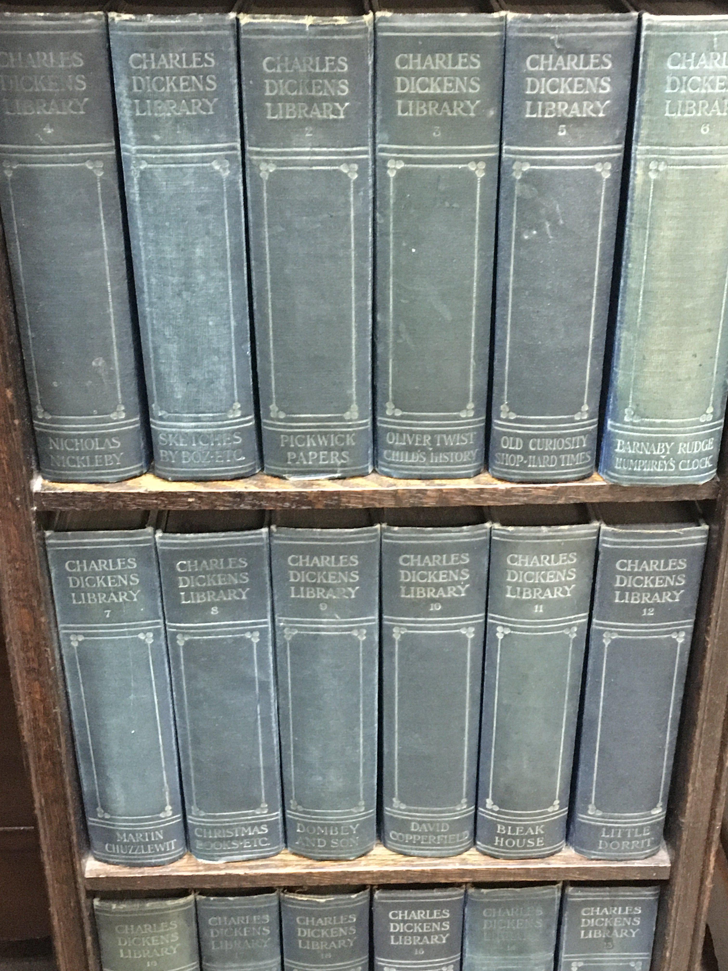 Later edition dickens books in a bookcase 94cm tall.- NO RESERVE