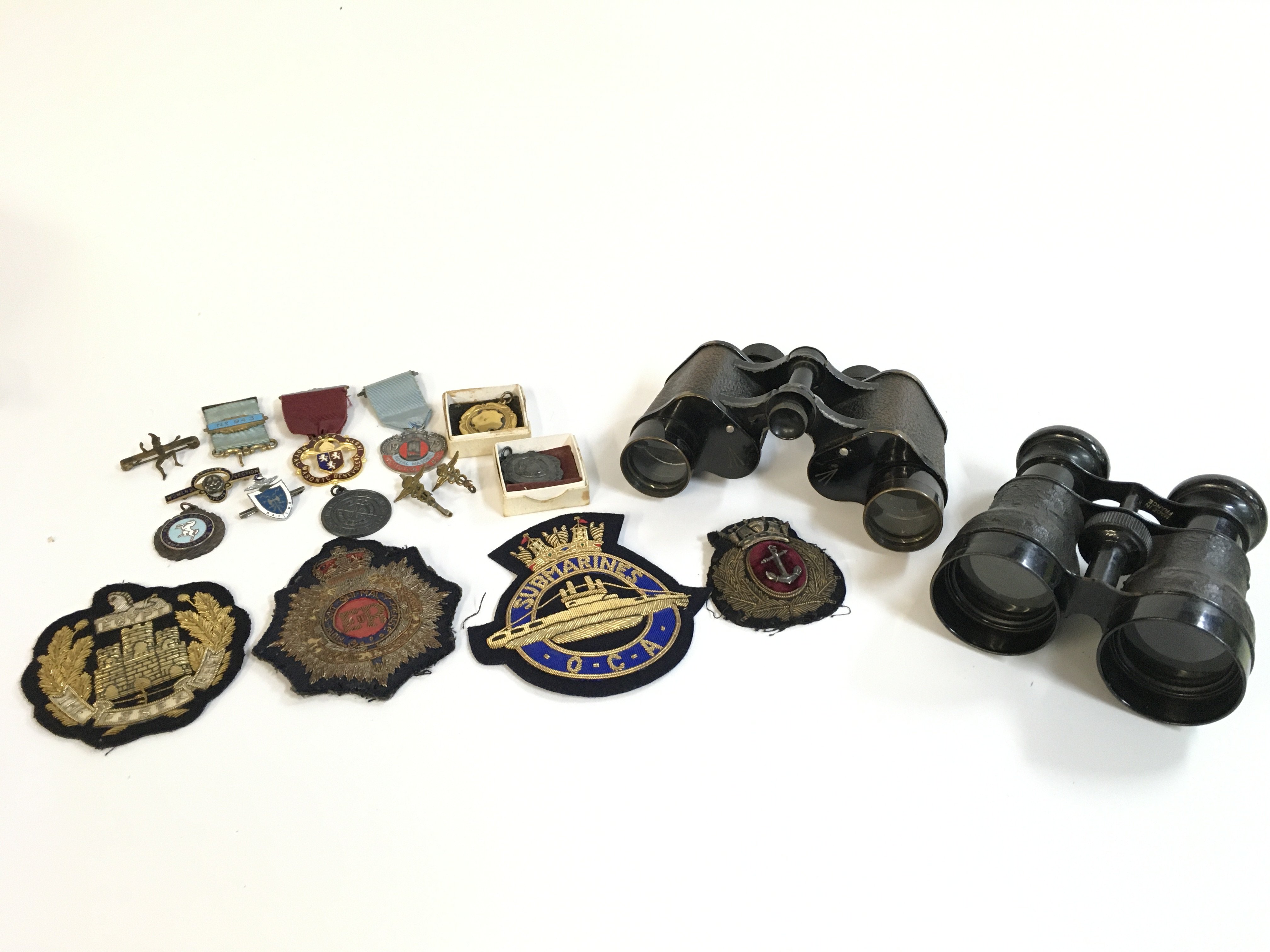 Military badges, WW1 binoculars, RAF badges etc . Postage category B