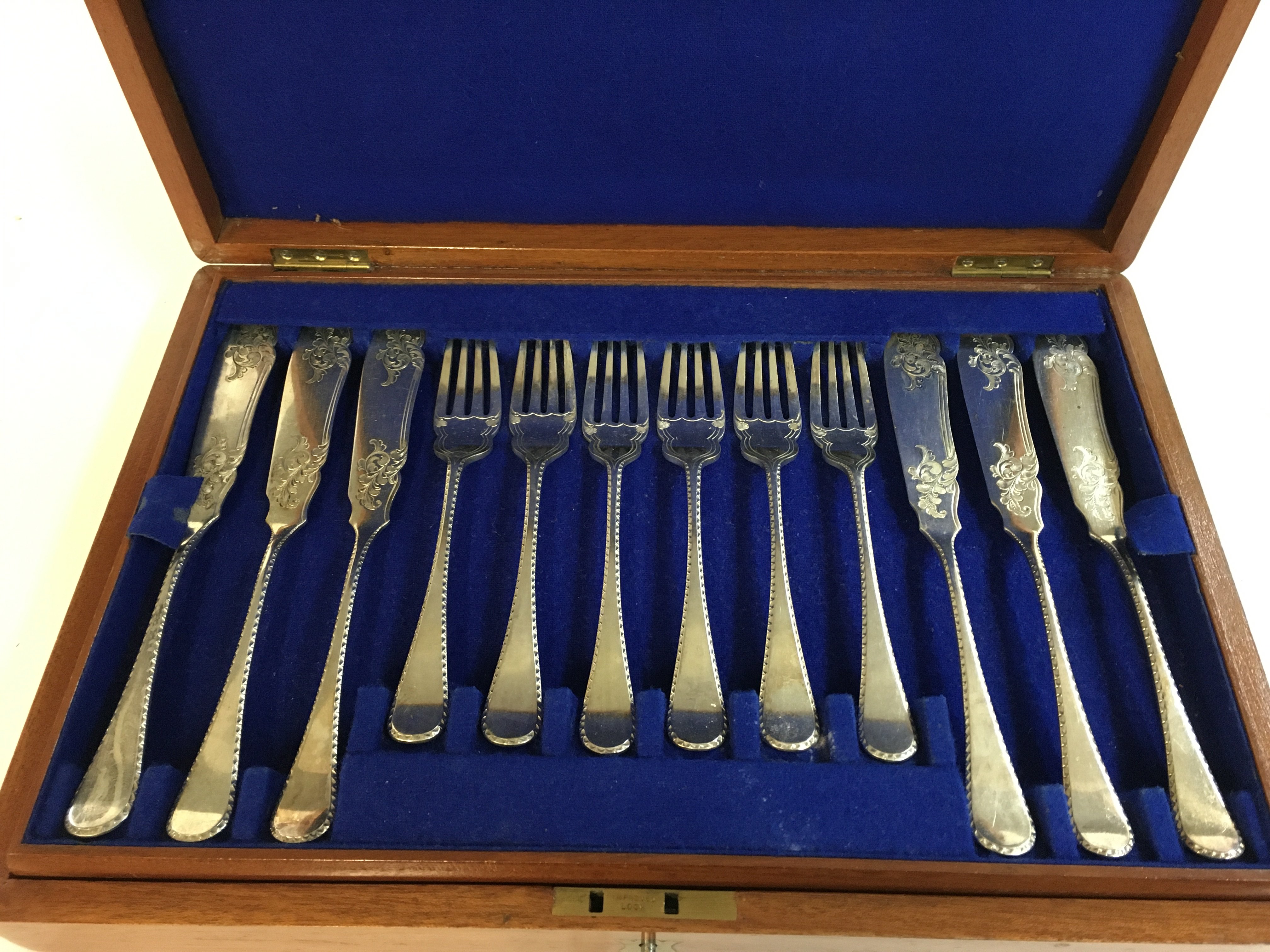 A two tier fish knives and forks cutlery set . Postage category B