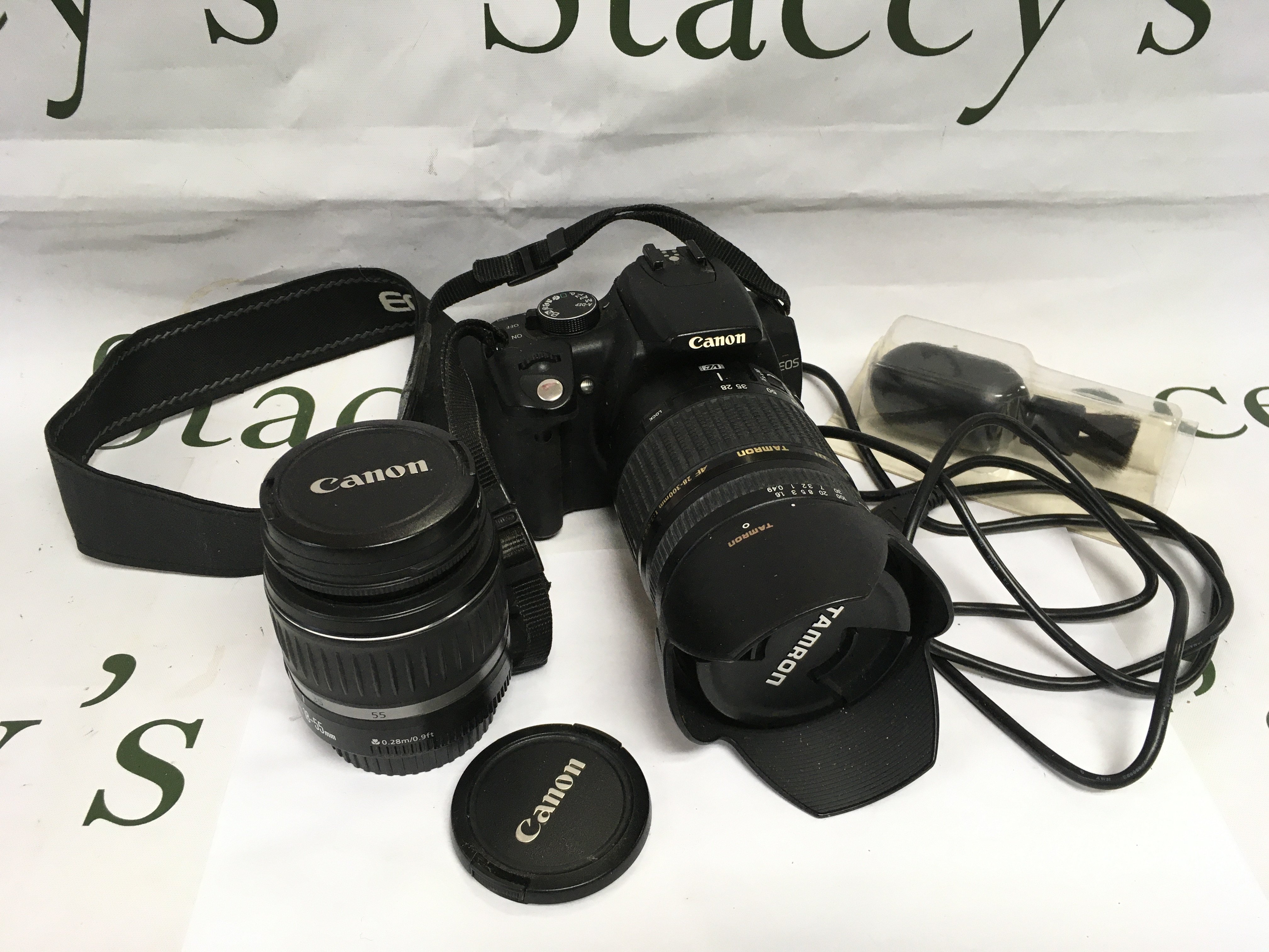 A Canon EO5 camera with two lenses and accessories. Shipping category D.
