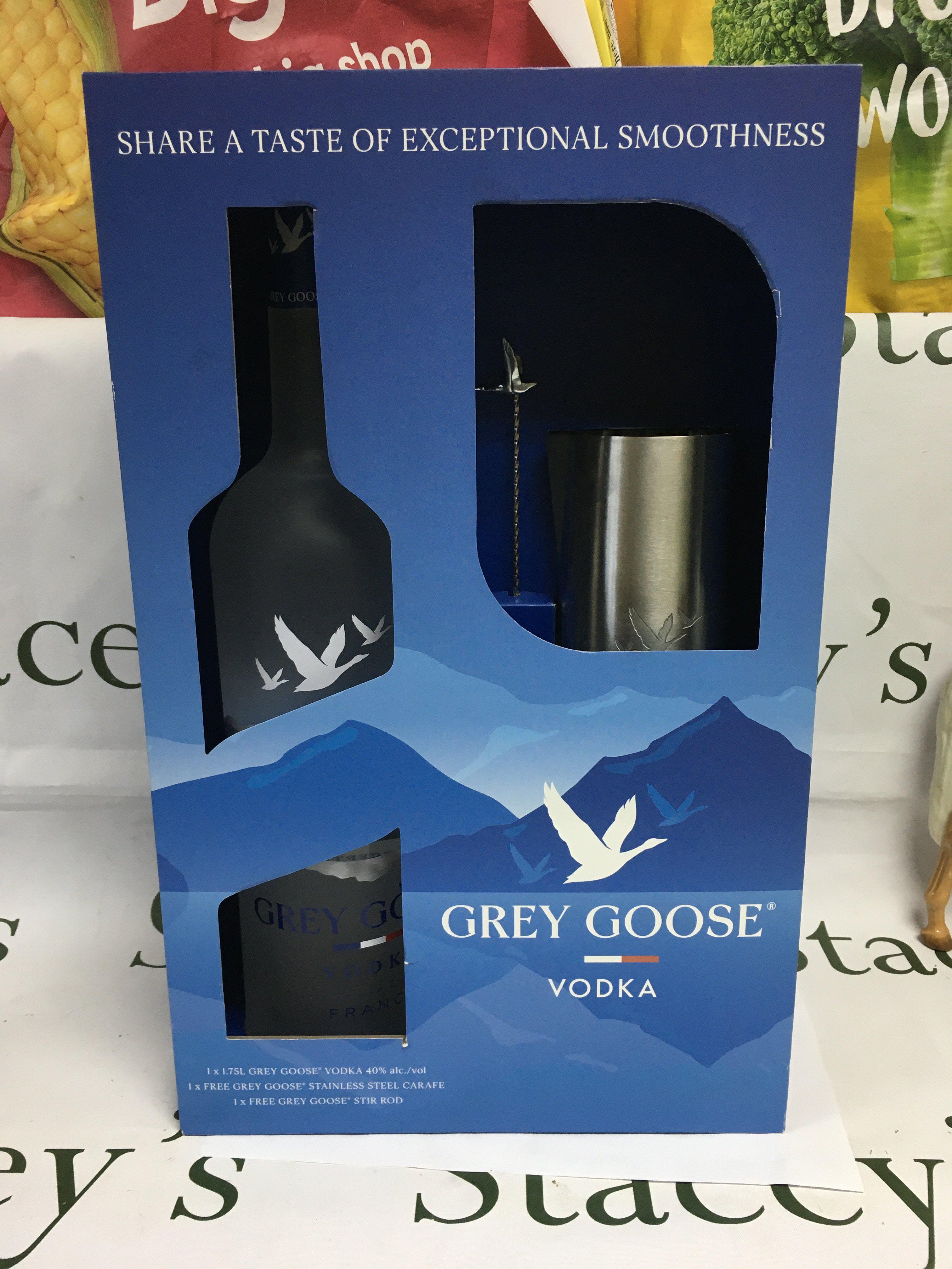 A boxed 1.75L bottle of Grey Goose vodka with stainless steel carafe and stirring rod. Shipping category D.