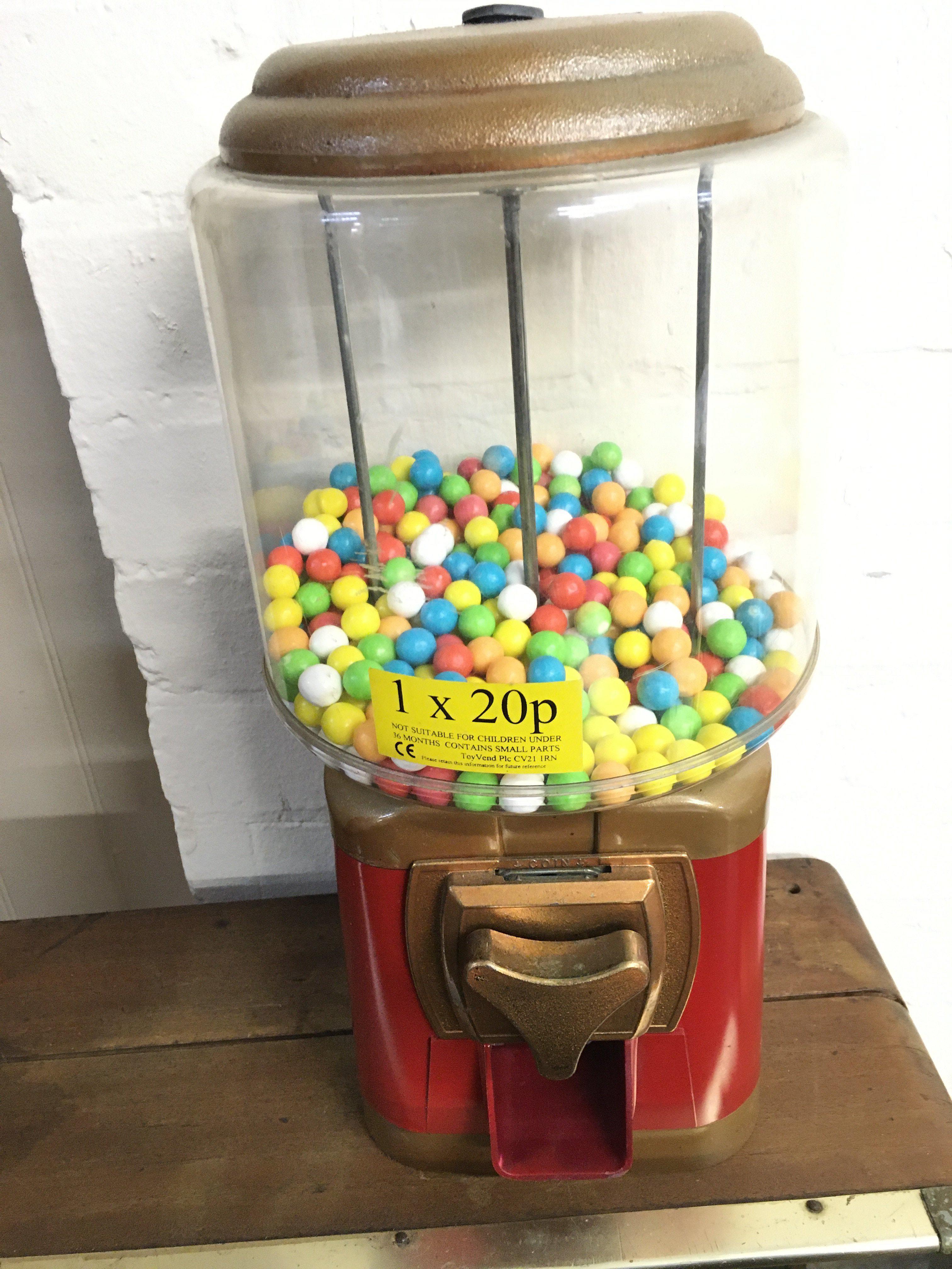 A Coin Operated Gumball Machine.