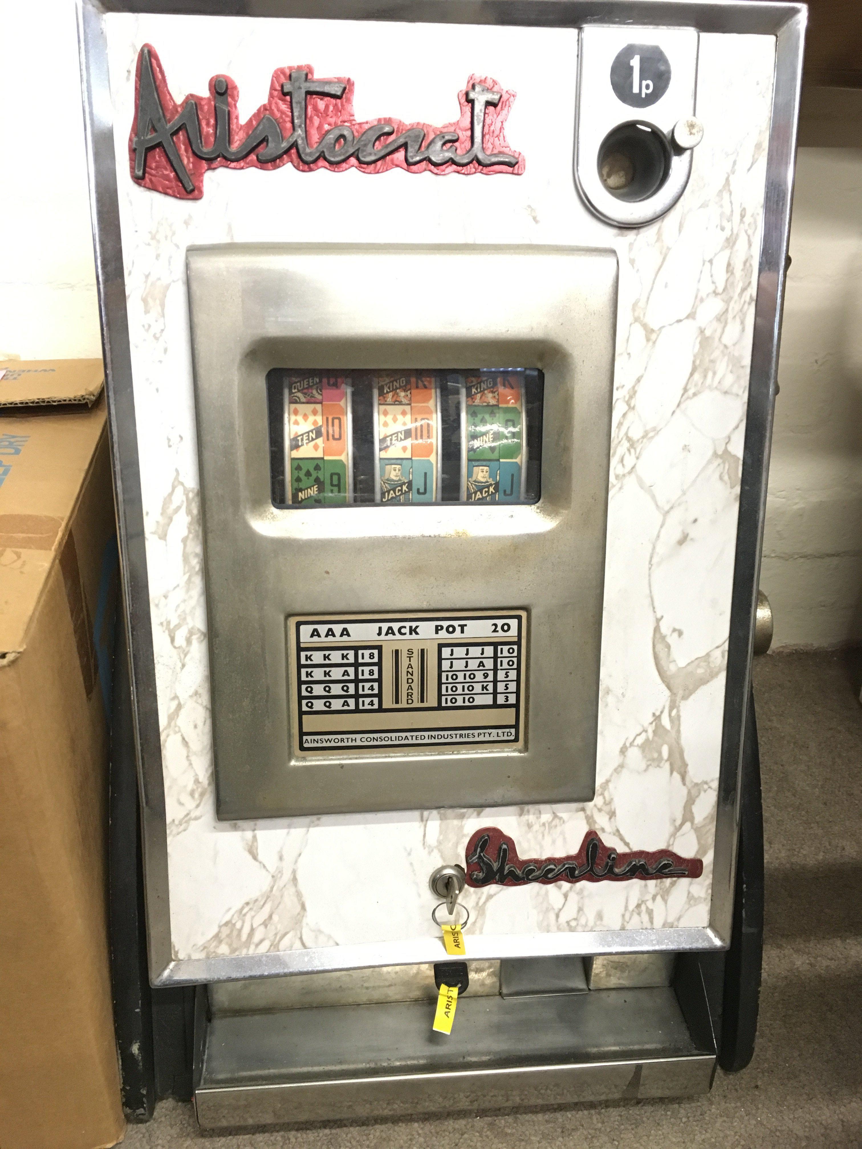 A Vintage 3-Reel Sheerline Aristocrat One Arm Bandit. Approx Height 68Cm.