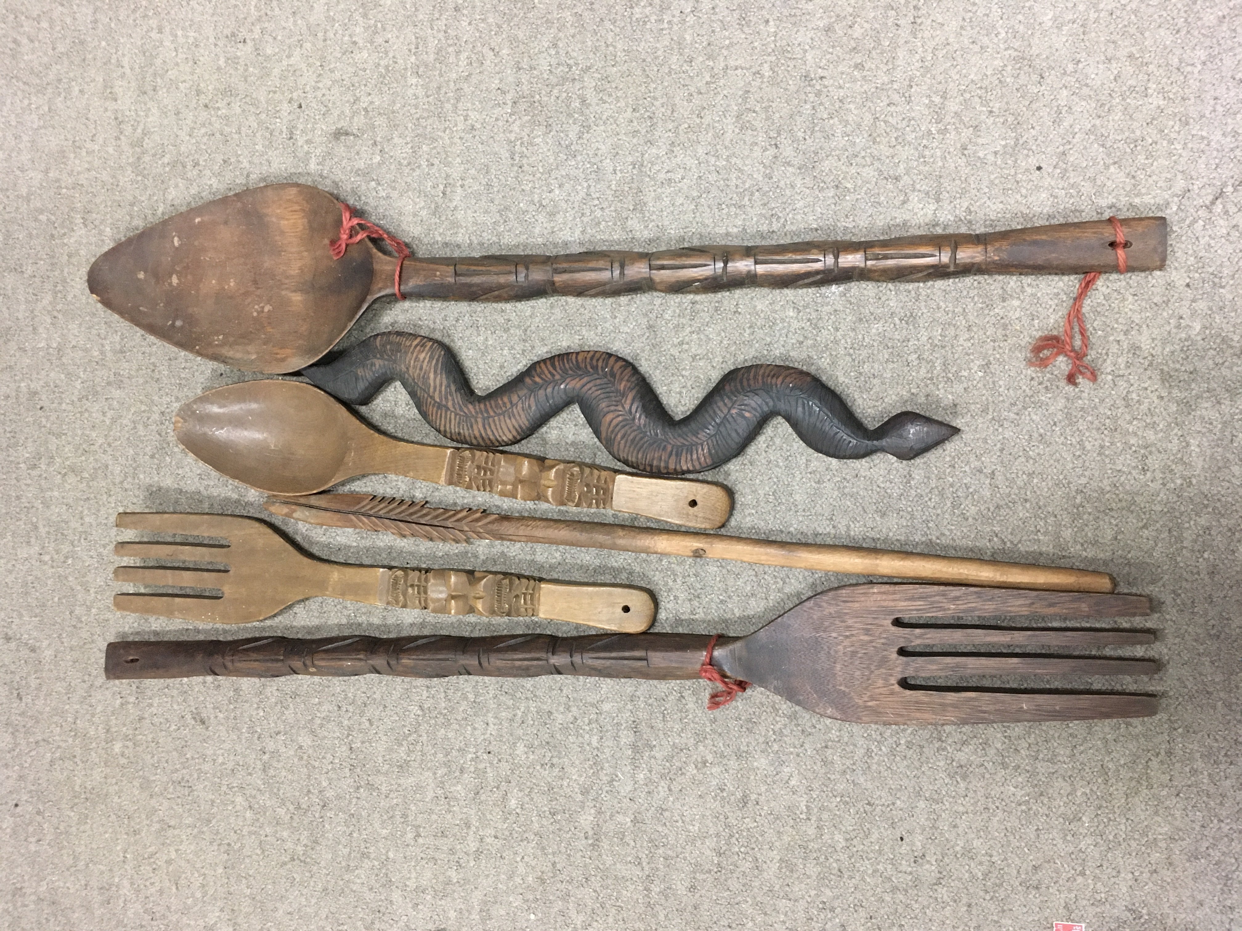 A collection of New Zealand wood carvings. Shipping category D.