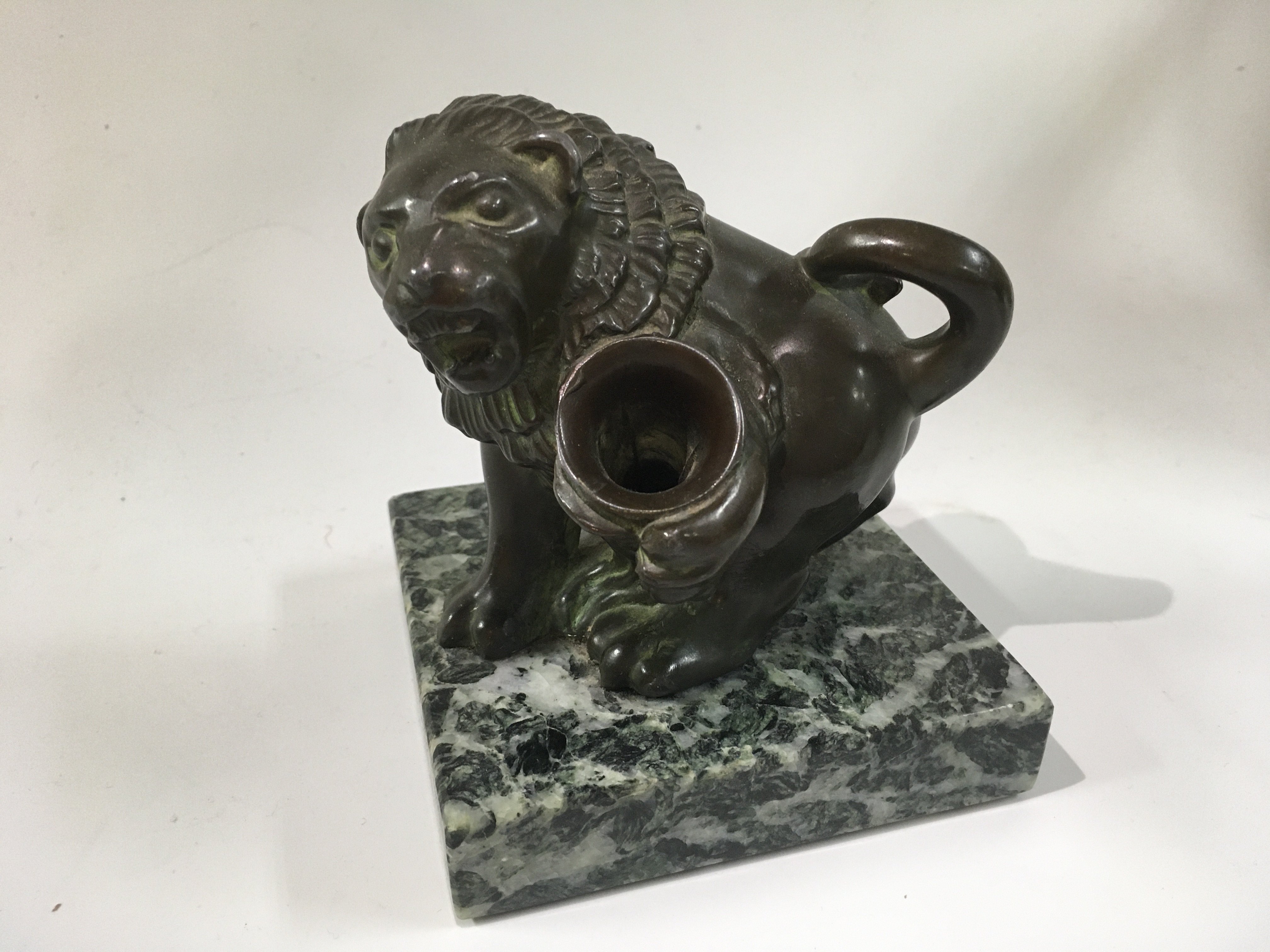 A Victorian style bronze lion figure pen holder.
