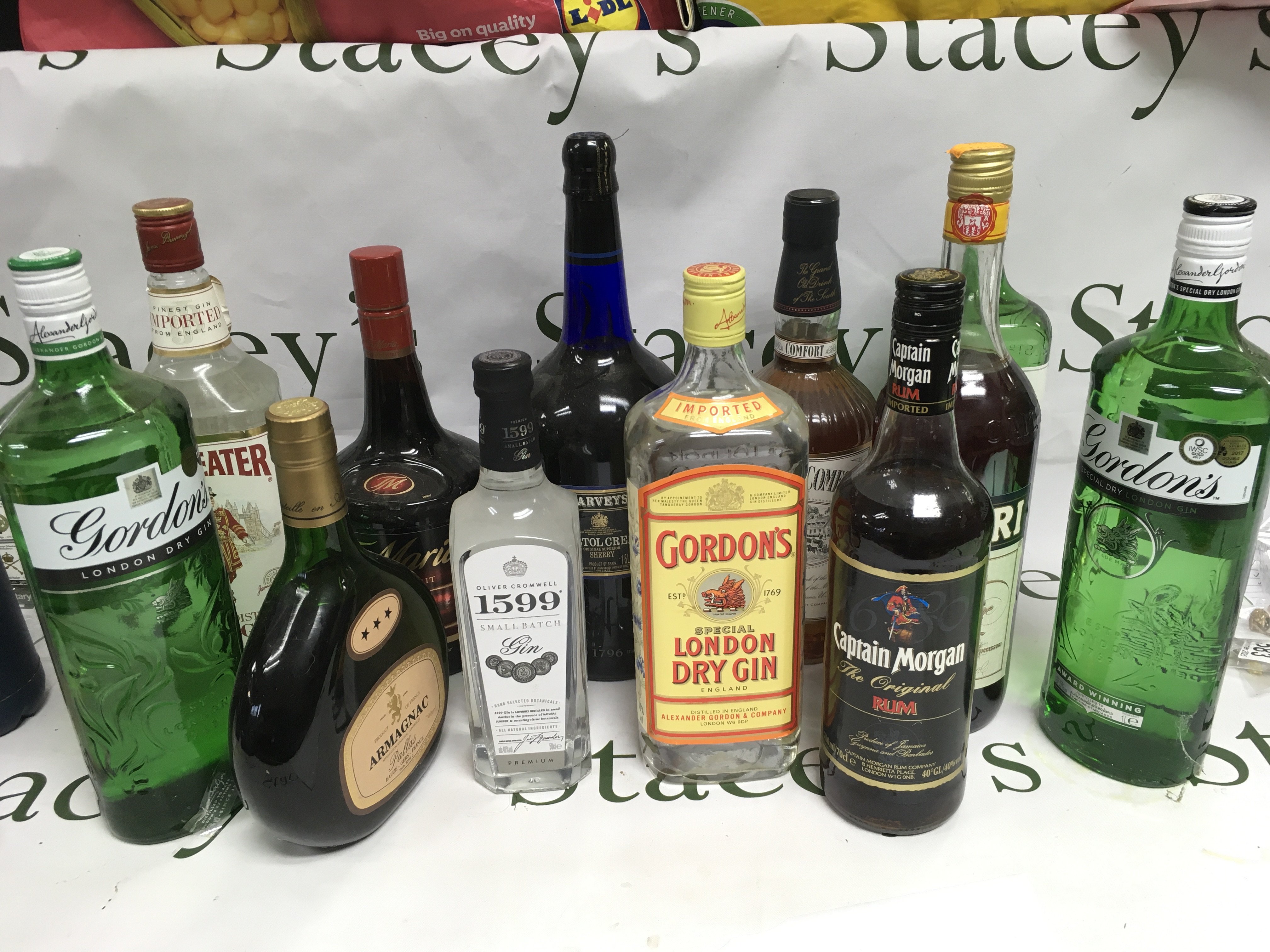 Twelve bottles of spirits comprising Gordon's Gin, Southern Comfort, Captain Morgan Rum etc. Shipping category D.