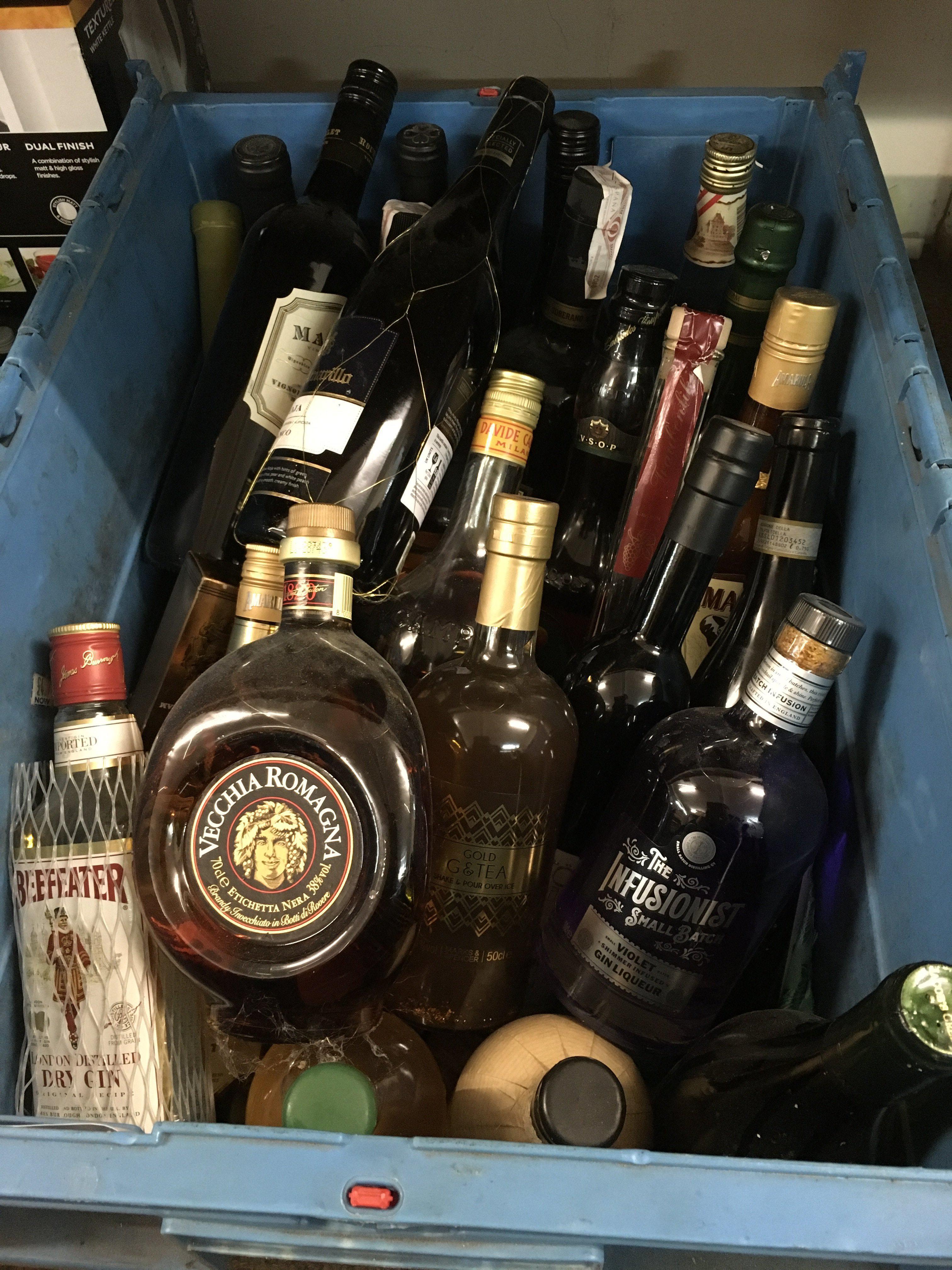 A box and a bag containing a large collection of spirits including various makes of gin, port, rum etc. Shipping category D.