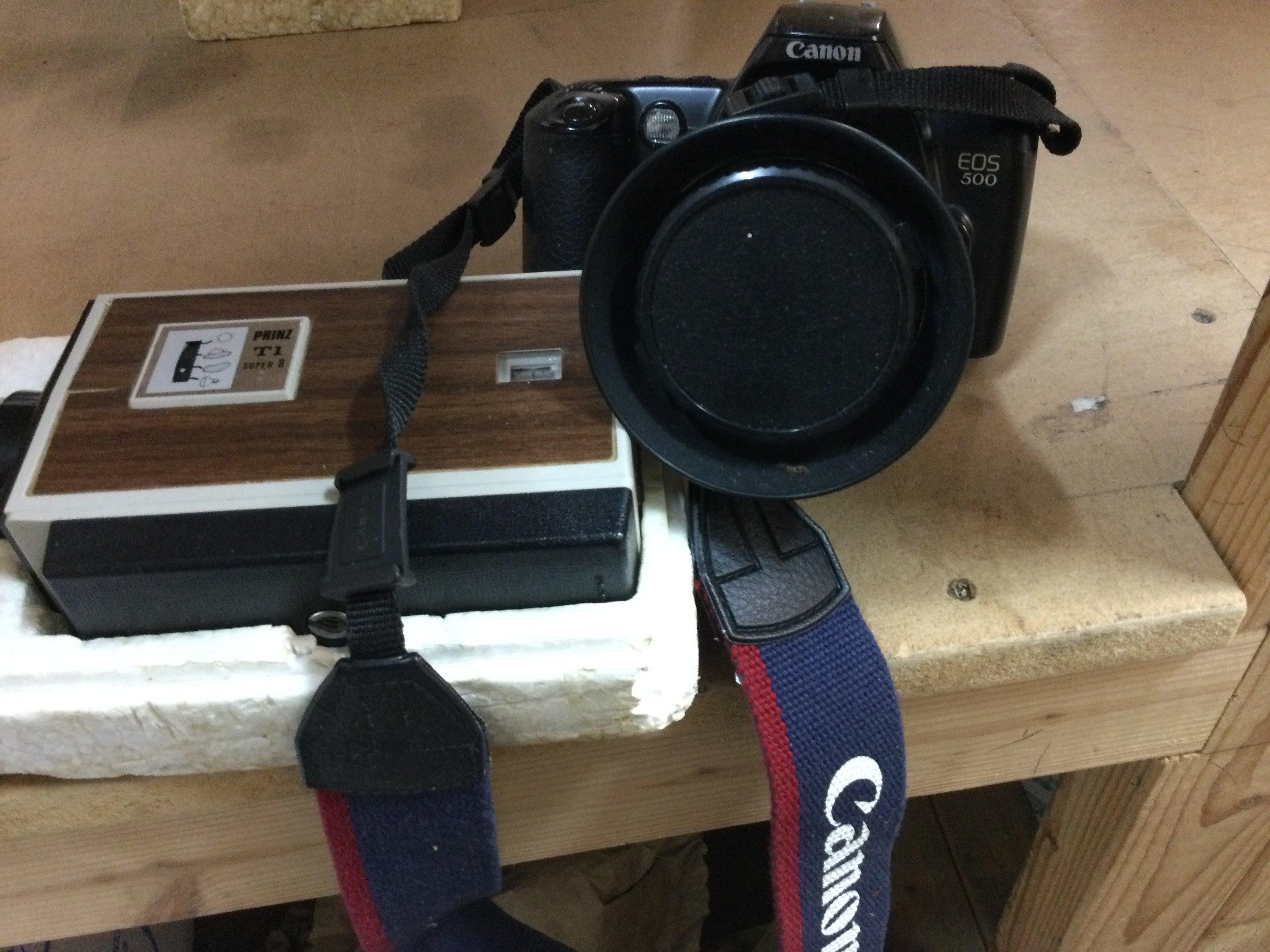 A collection of cameras including cannon .