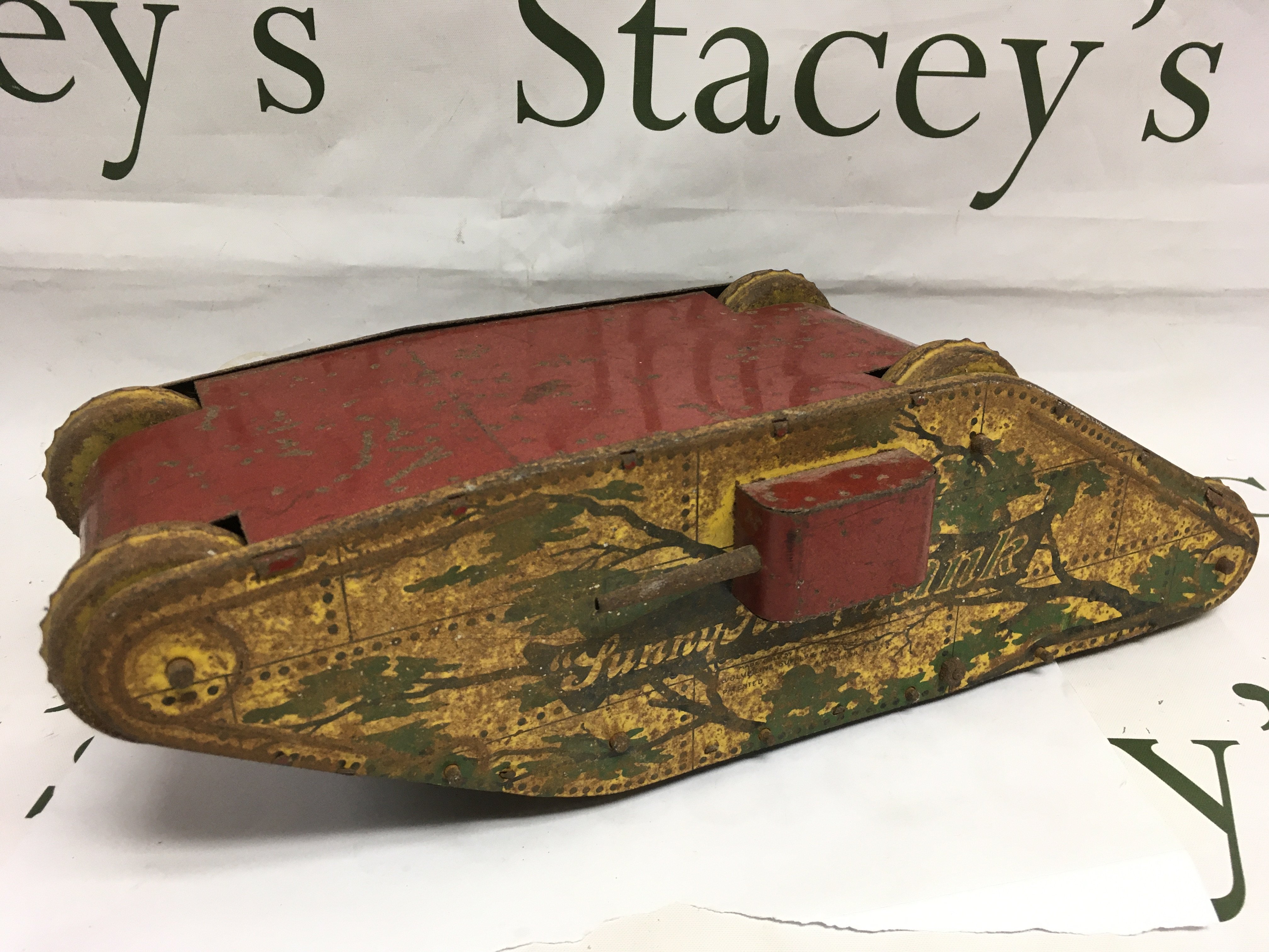 A vintage tin plate clockwork tank, approx length 36cm. Shipping category B.