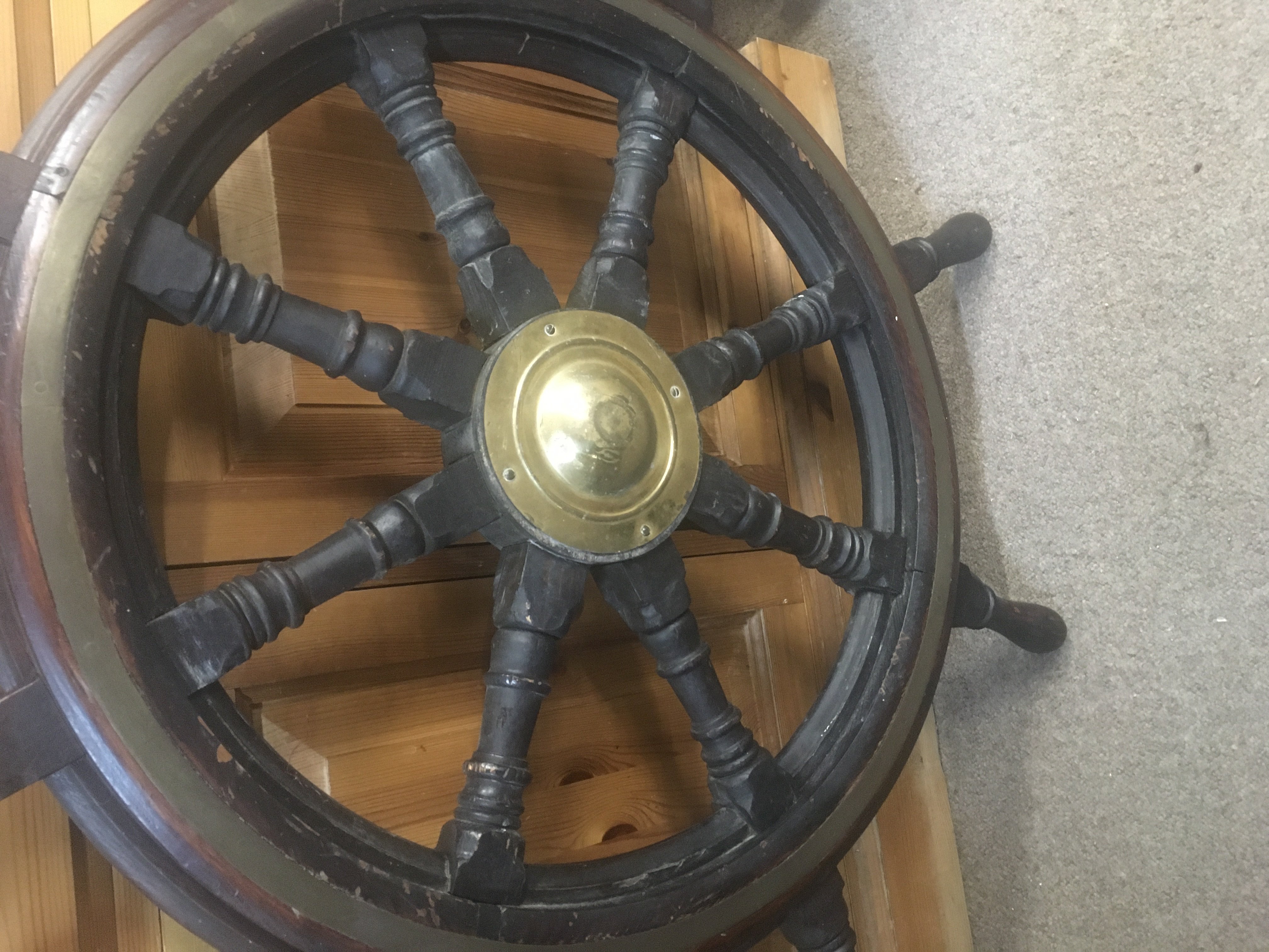 A ship&#2013265924&#2013266171s wheel with brass central inset .