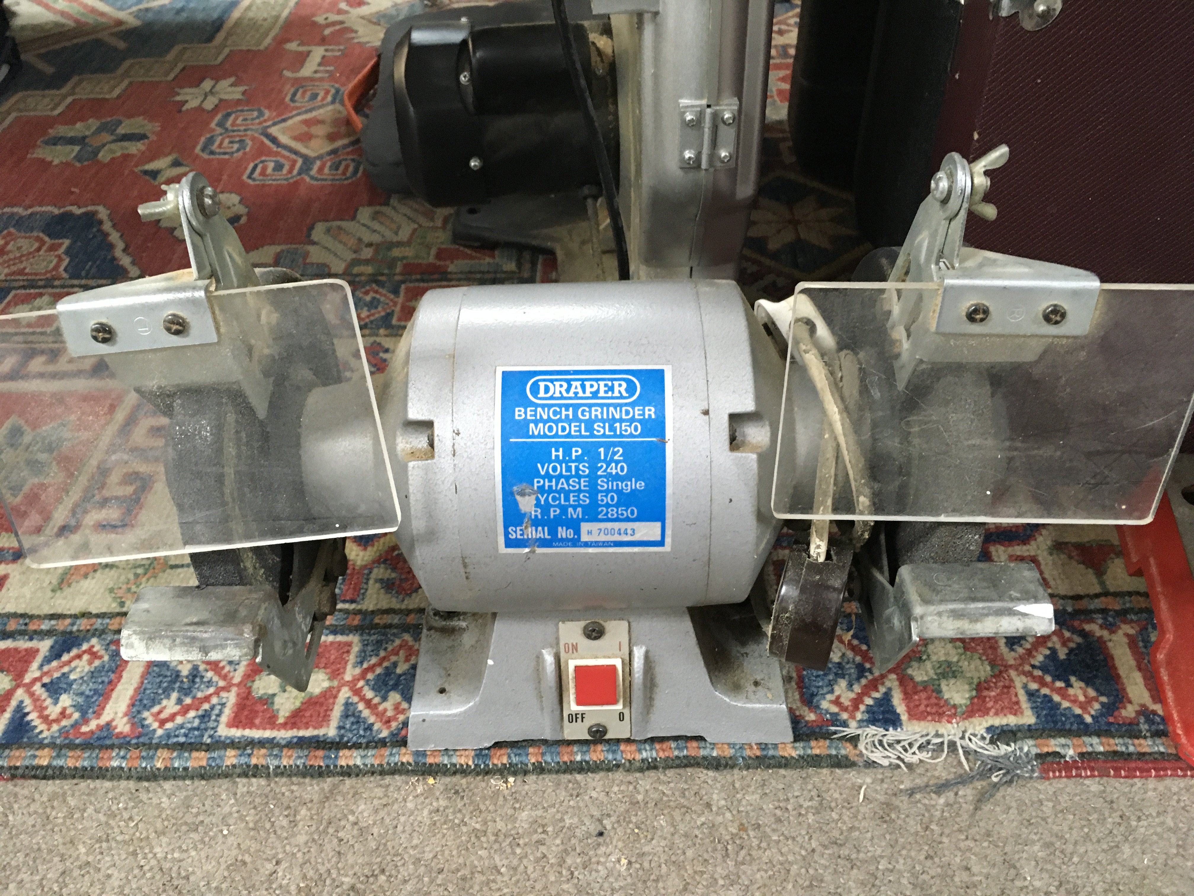 A Sealey bench drill model no.sdm30 and a Draper bench grinder model SL150