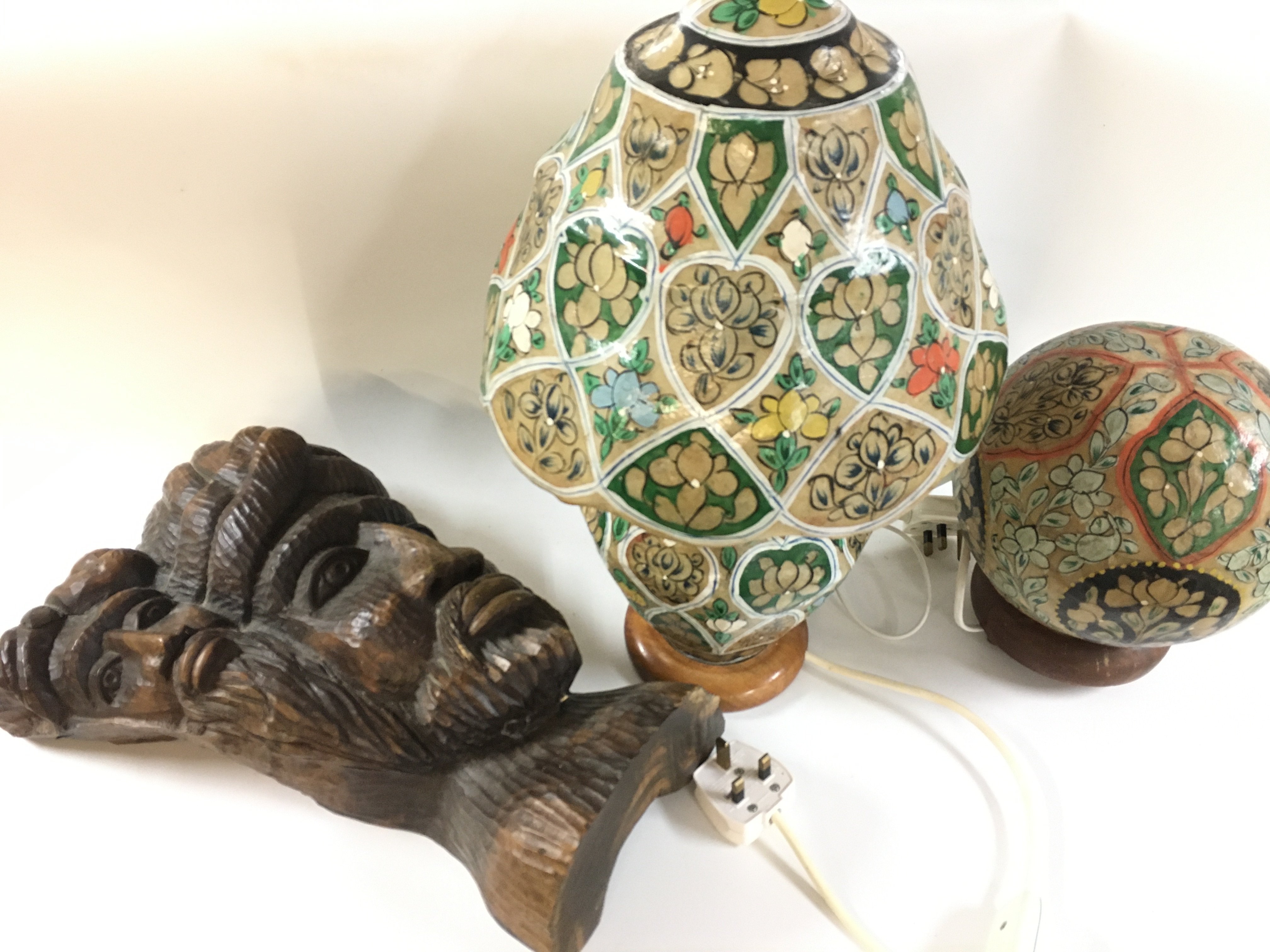 A carved dark wood bust sculpture (40cm tall) and two paper mache hand painted lamps . 25 and 44cm tall This lot cannot be posted