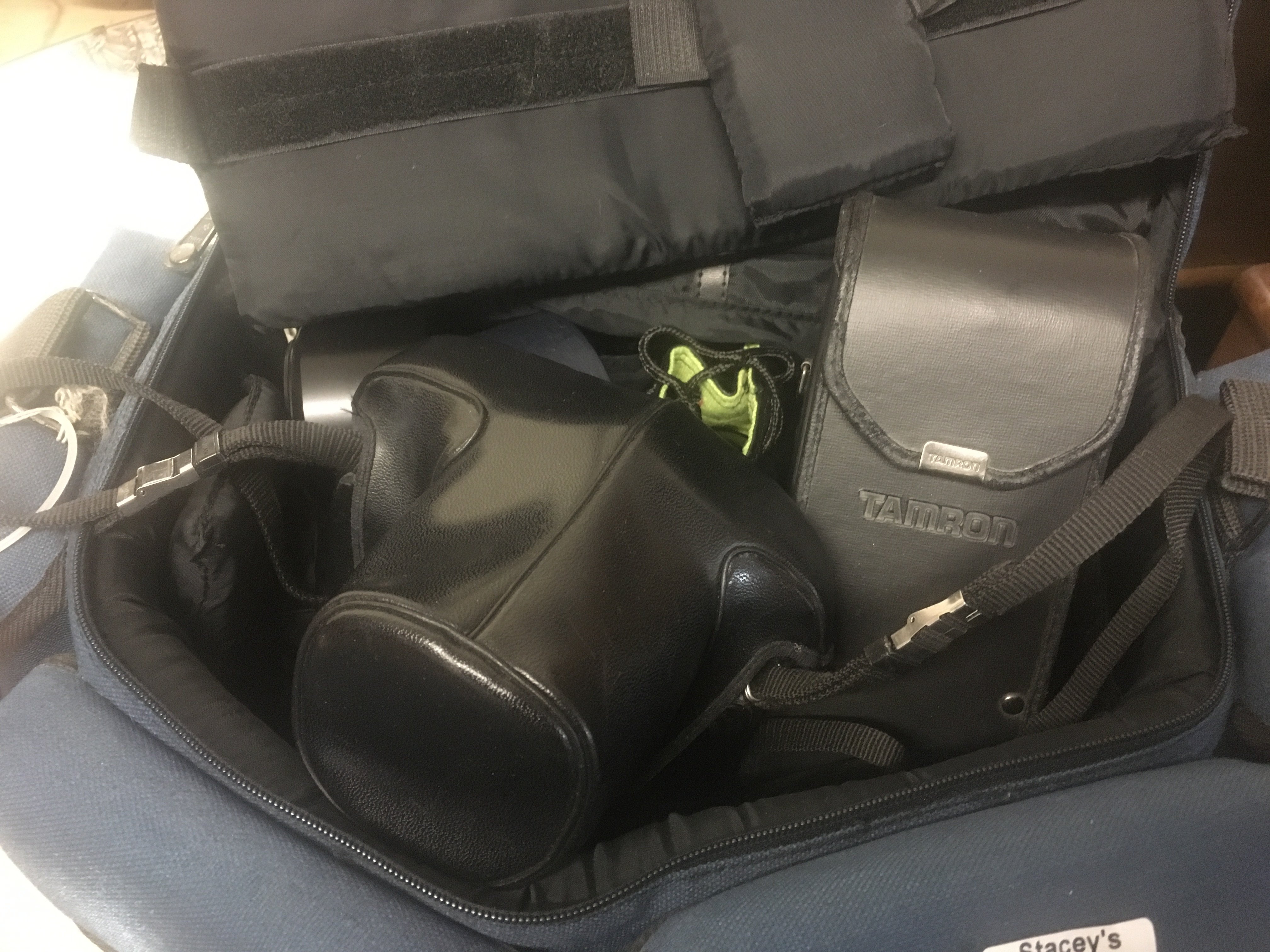 A Pentax ME Super camera with accessories fitted in a blue holder.