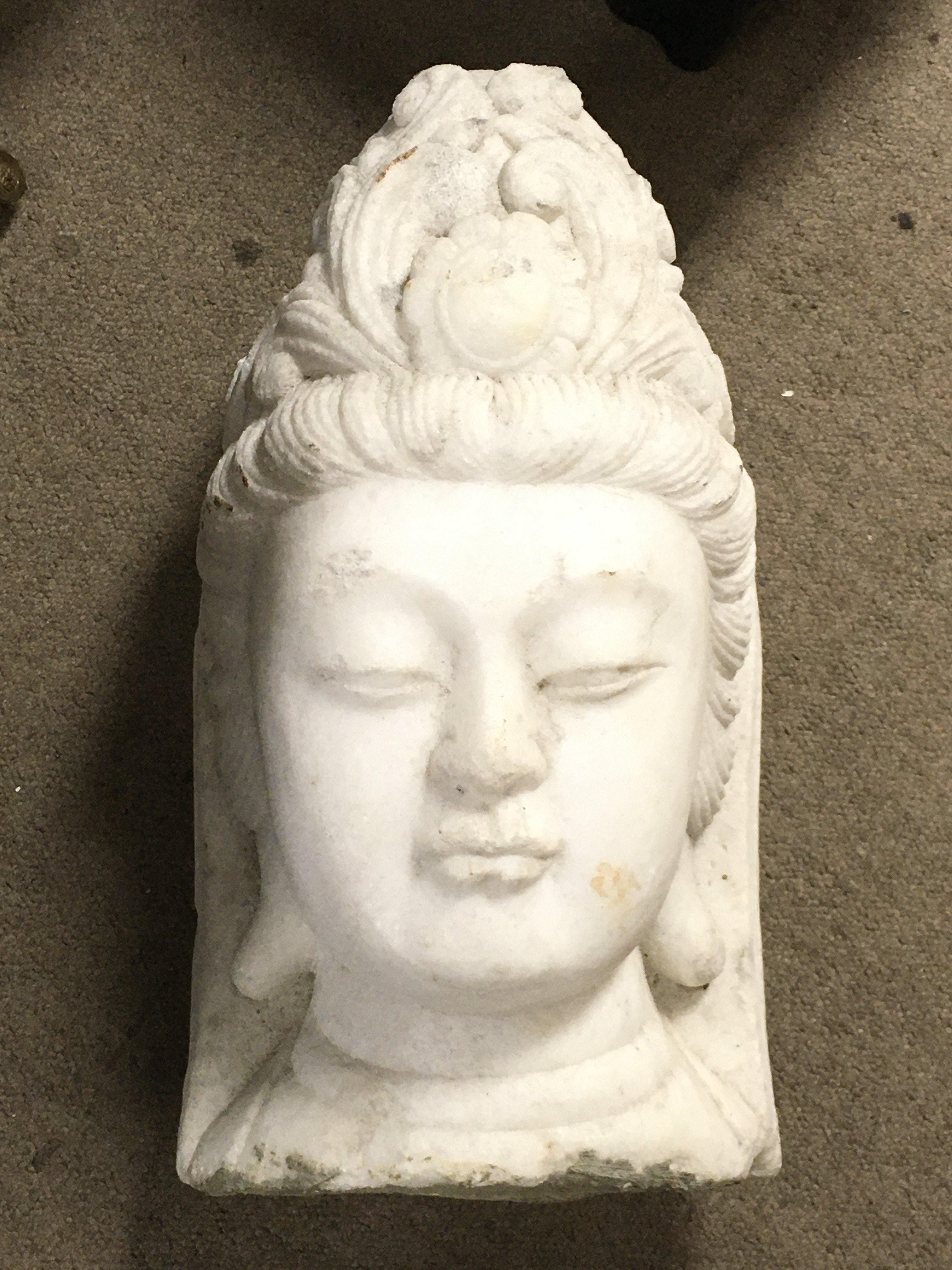 A marble buddha bust , 52cm tall 30cm wide approximately . no reserve