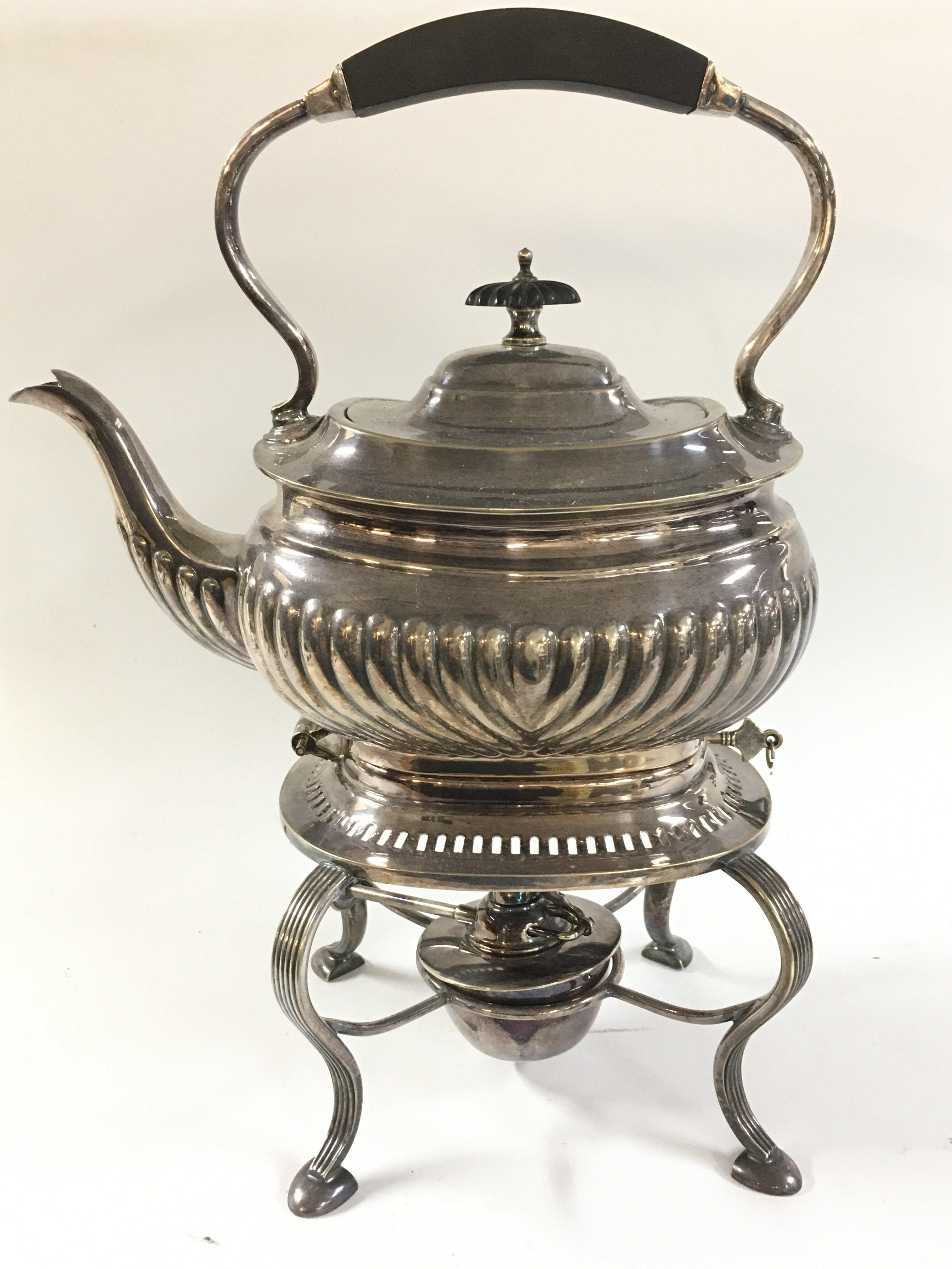 A silver plated spirit kettle , 32cm tall.