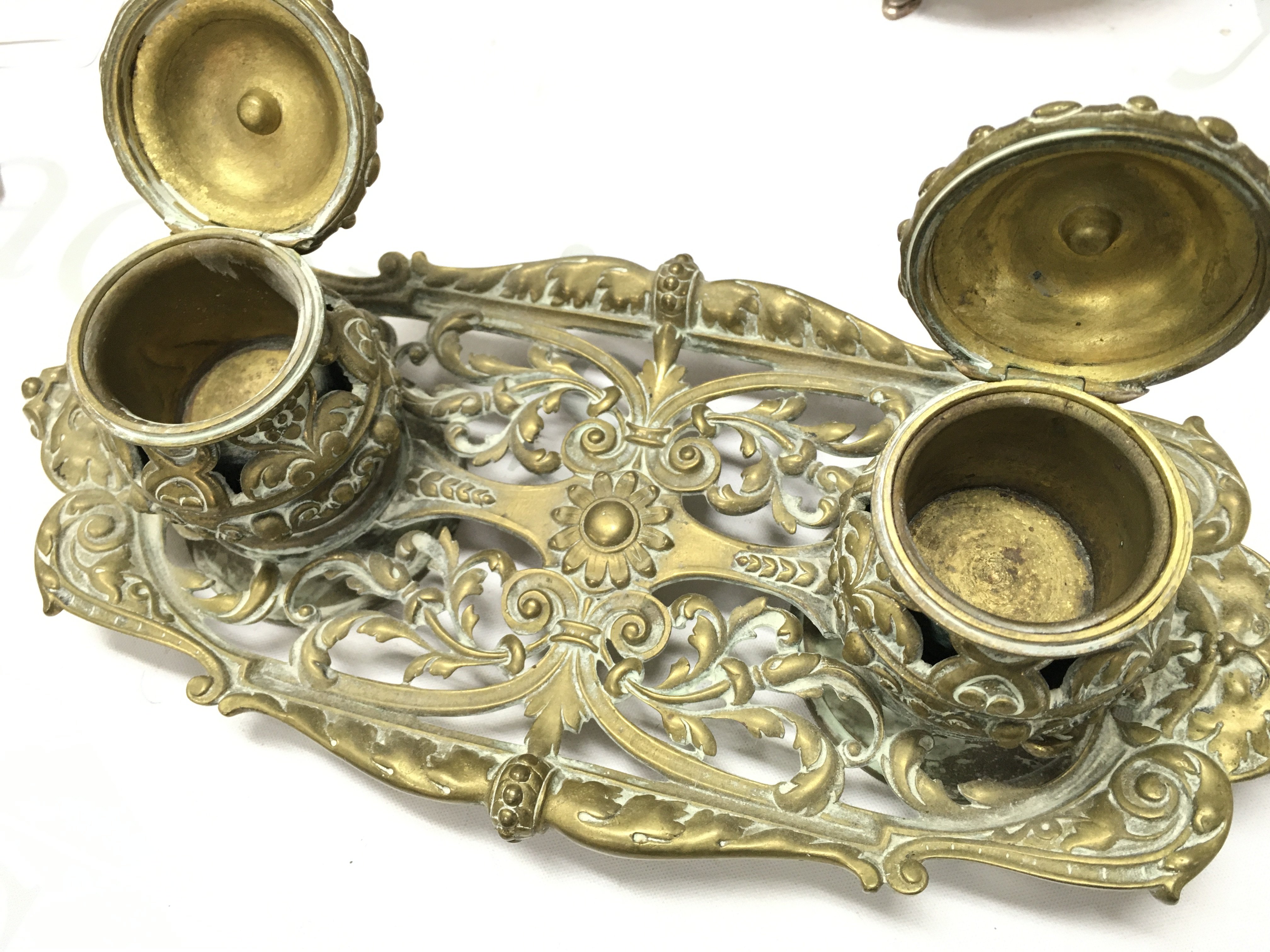 A brass inkwell , 28cm wide. Postage category B- NO RESERVE