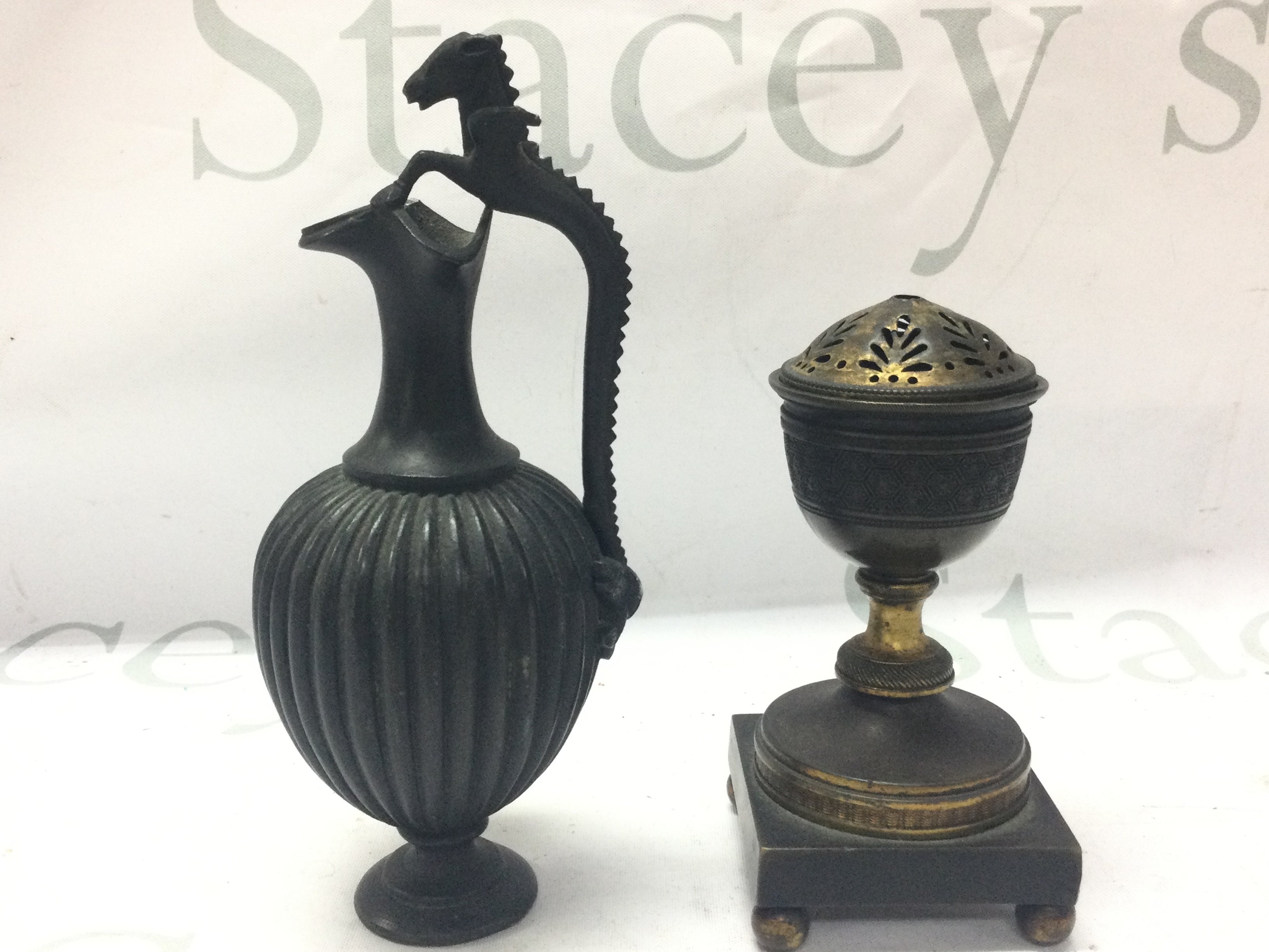 A small bronze ewer and a George III gilt metal pot porri 13 and 17cm tall. Postage category B