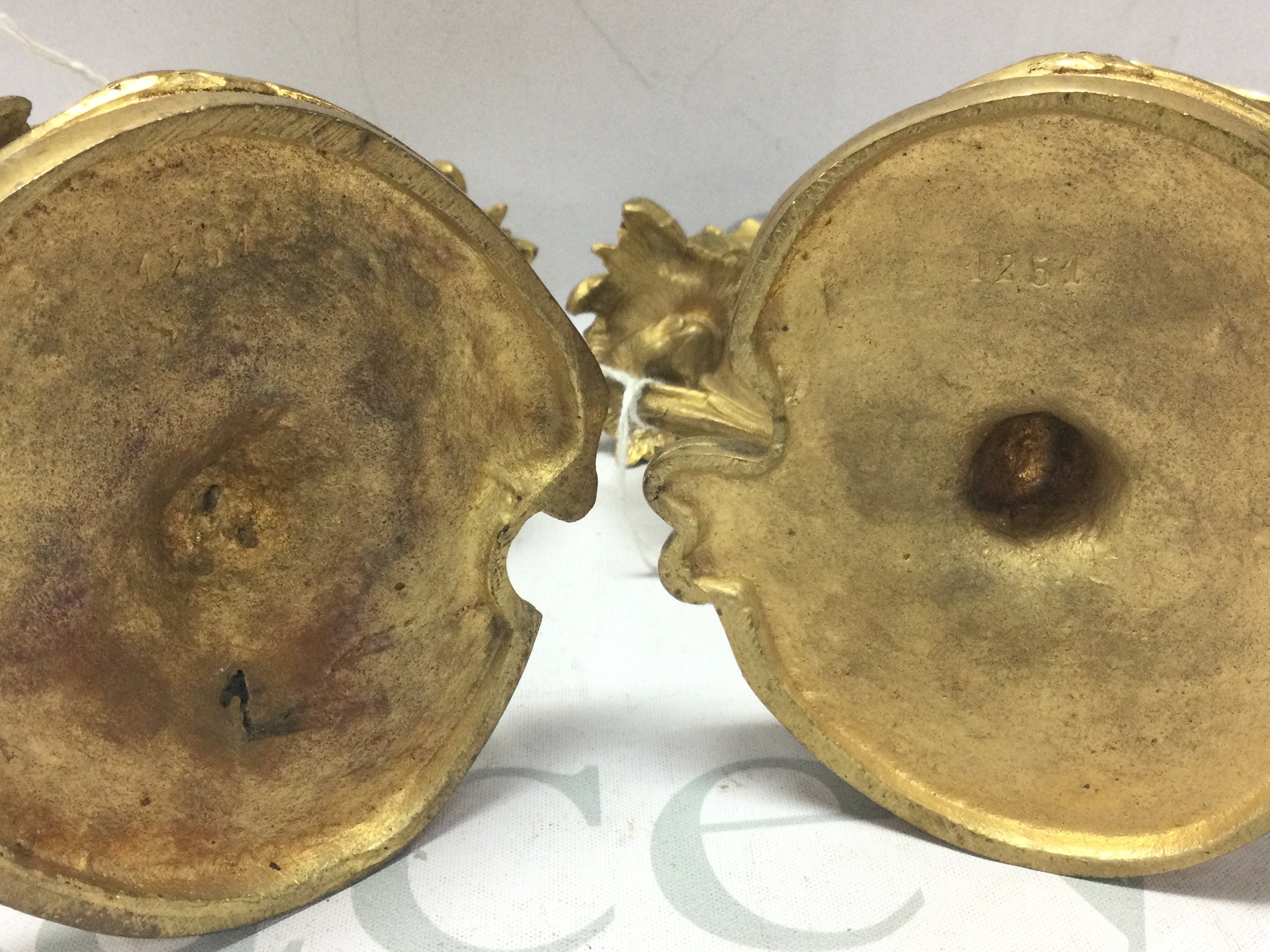 A pair of French ormoulo candelabras, approximately 15cm tall. 21cm wide. Postage category c