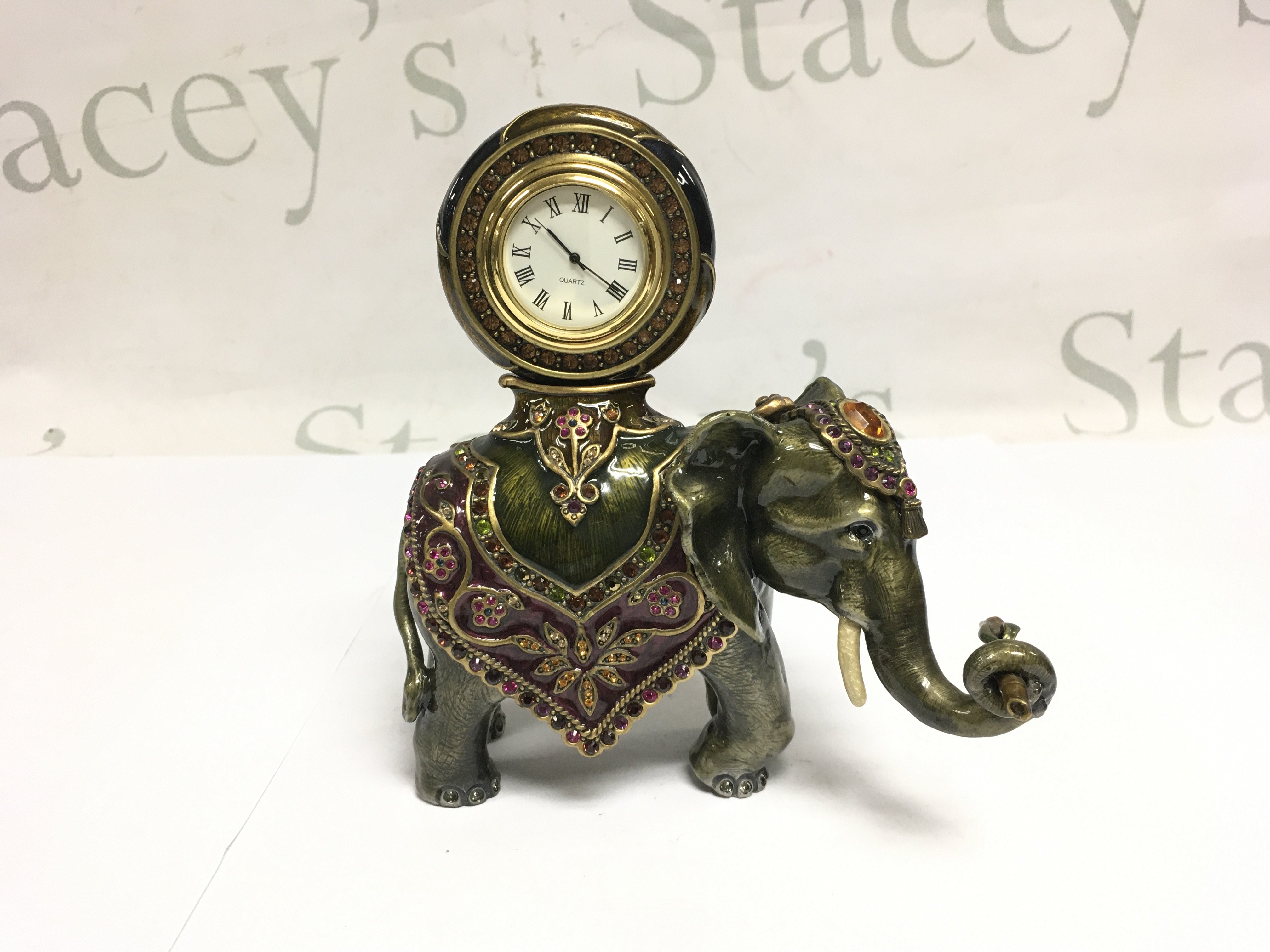 A boxed Jay Strongwater cast metal elephant figural clock decorated with hand set Swarovski crystals, approx height 15cm. Shipping category D.- NO RESERVE