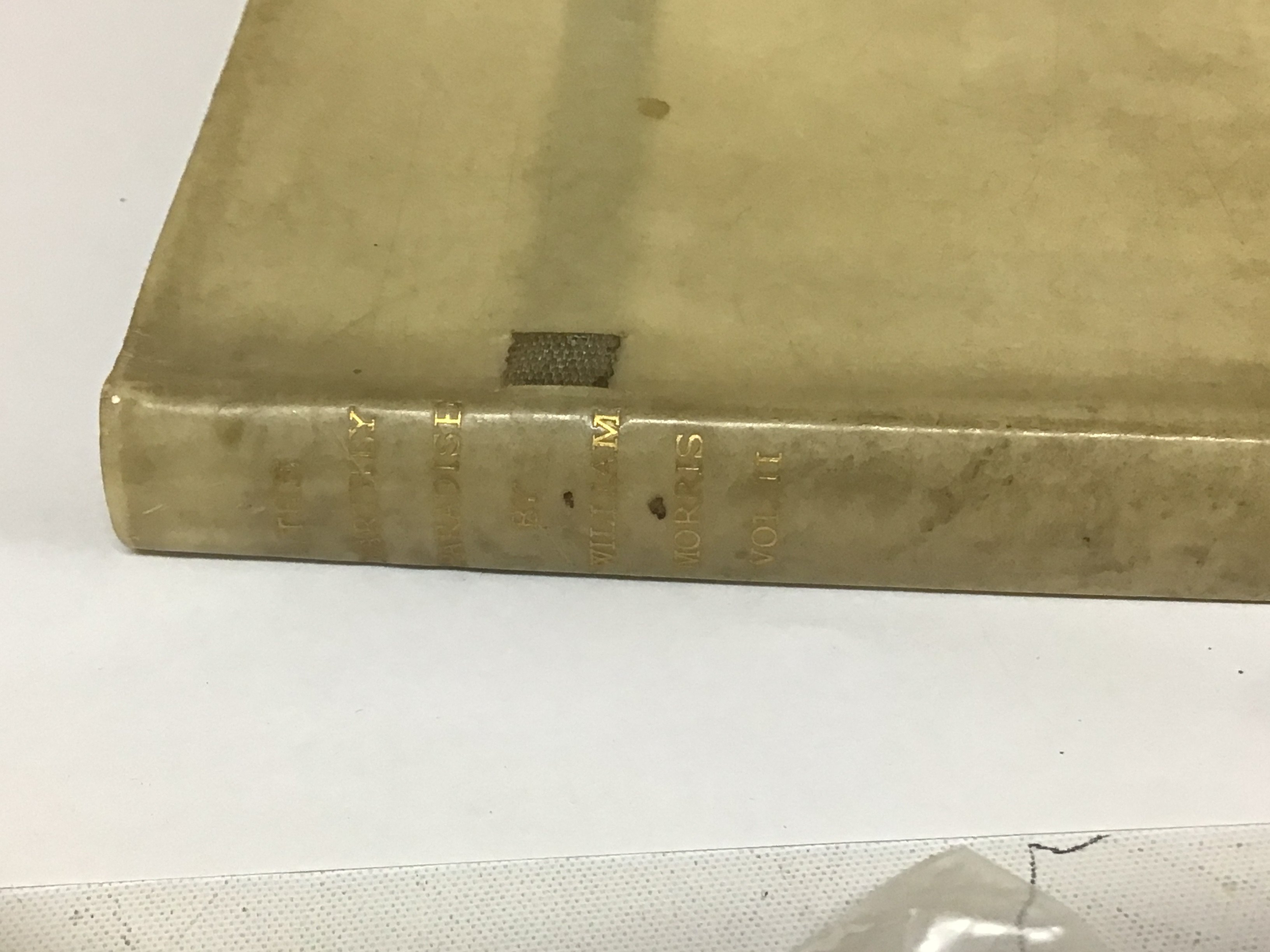 A Rare Copy of William Morris The Earthly Paradise Vol II printed by William Morris at the Kelmscott Press and finished on the 24th day of June 1896 Black ink with red corner titles The Doom of King Acrisius unfortunately with six leaves missing 82-95 the book bound in velum with gold lettering to the spine and ribbon ties the book with applied label Coat of Arms for Edward Penton and Albert Louis Cotton.