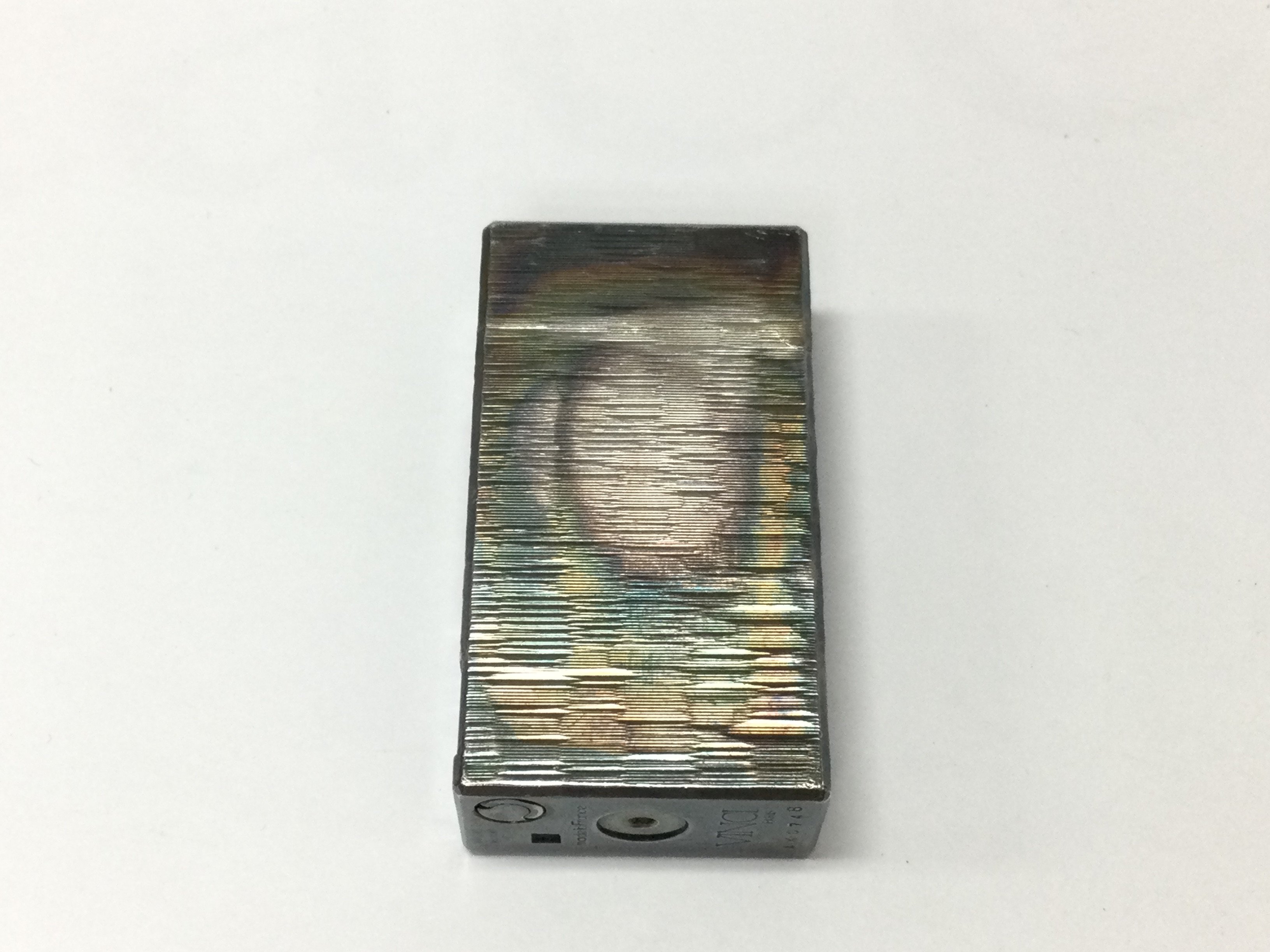 A vintage Vinci Paris lighter with nice patina.Postage A No reserve