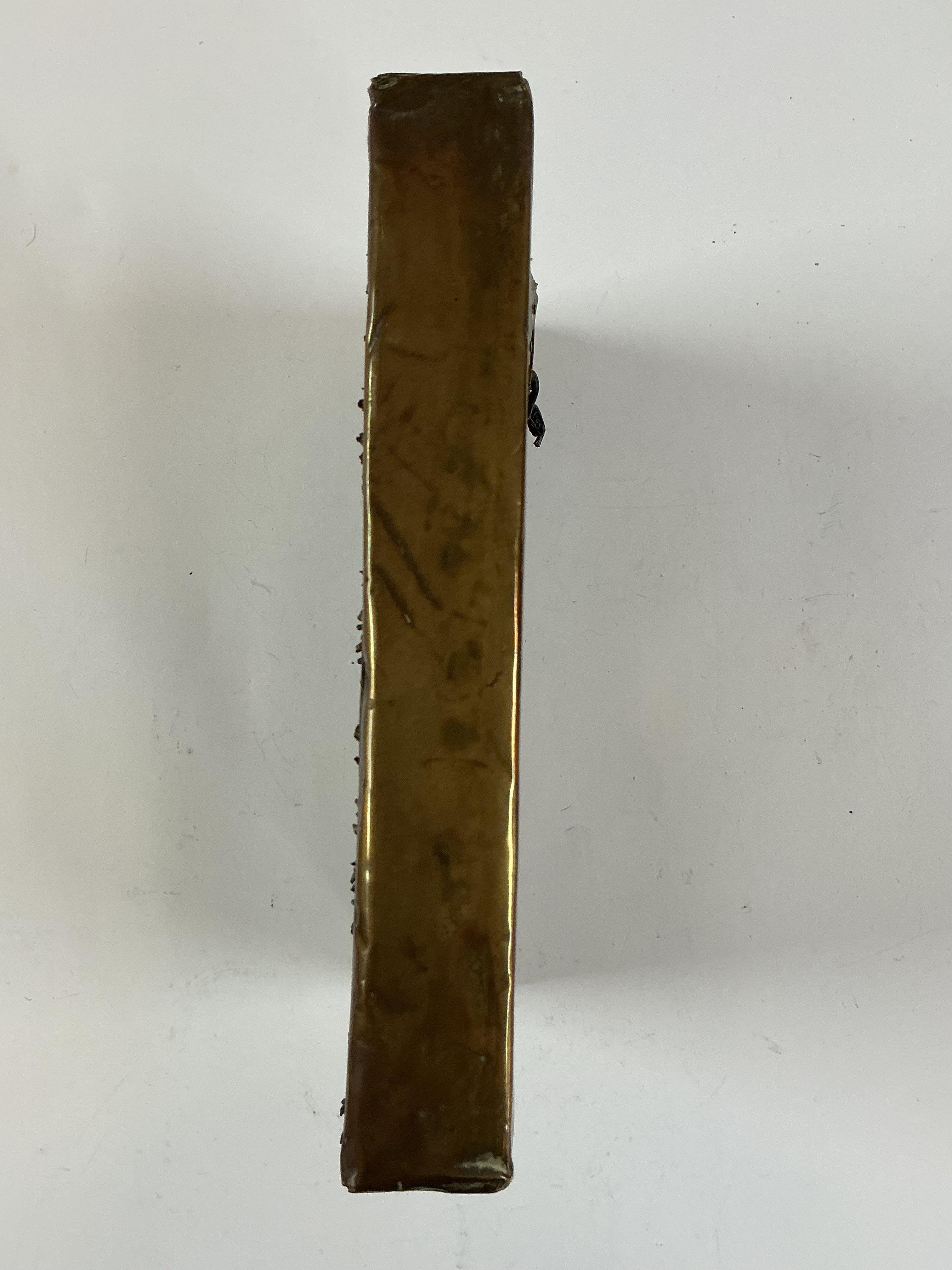 A Gilt Copper Votive Plaque Tibet / Nepal, Late 19th Century Centred by a seated Buddha on lotus base, with all over floral inlaid stone sprays, within a rectangular panel, and floral stone inlaid border. 20cm x 15.4cm. Prov. From the estate of Maharaja Bahadur of Burdwan" refered to as Sir Bijay Chand Mahtab (1881&#2013266057&#2013265947&#20132659381941), gifted to the vendors mother from the Maharaja of Burdwan in 1940 - (see attached gift card ). She said she'd admired it hanging on the wall at his Palace Residence - she first visited there early/mid 1930s. Whilst living, working near by and then married in India and became close to the Maharaja and his family until his death.