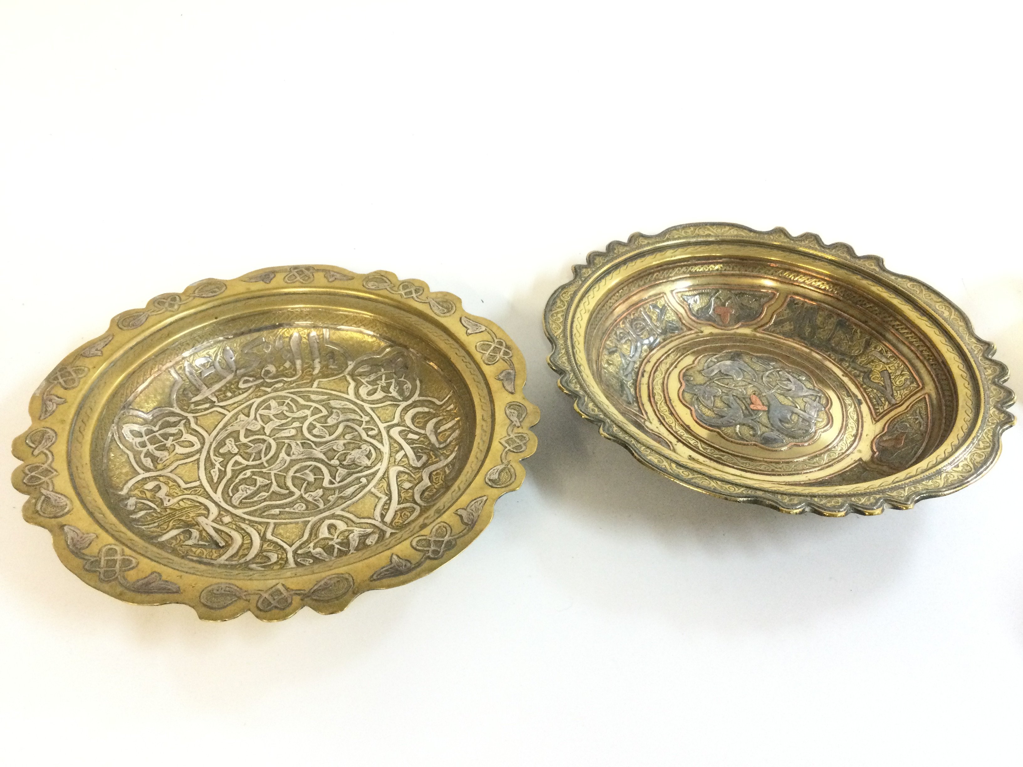 Two 19th century brass Egyptian / Syrian Cairo ware dishes with silver and copper decoration. 20cm wide approx . Postage category B