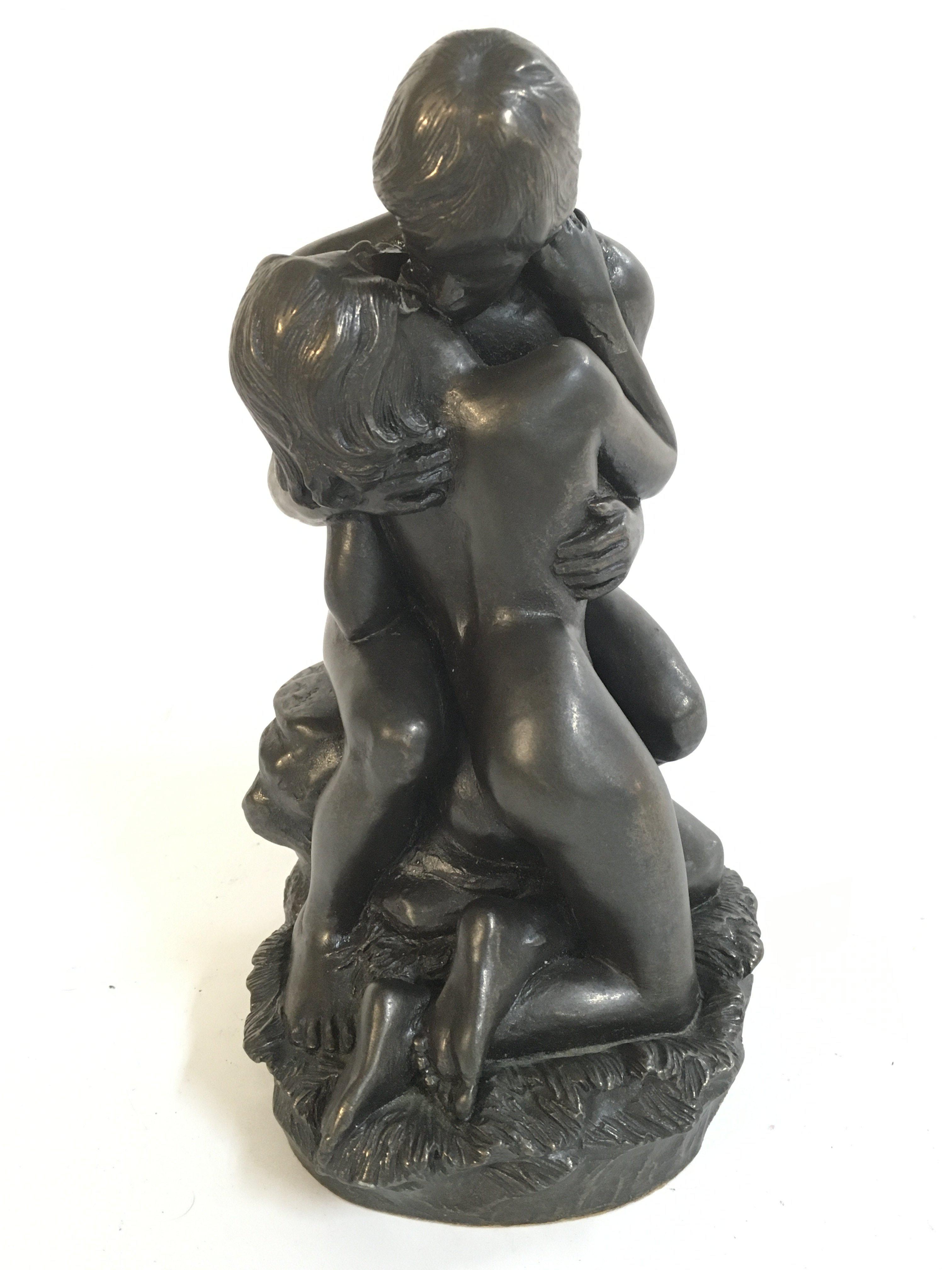 A bronzed Adam and Eve figure group , 17.5cm tall Approx . No reserve