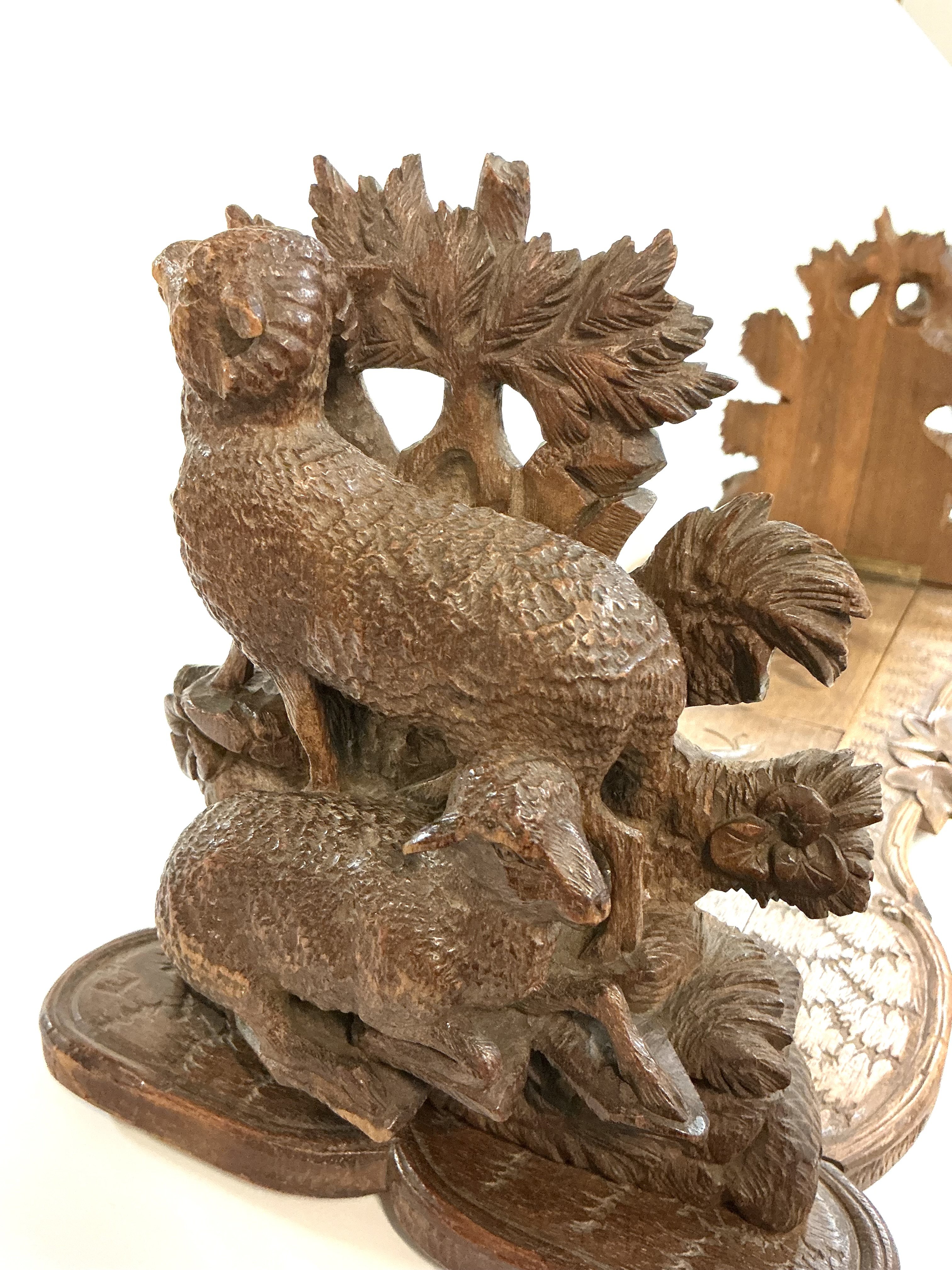 A good quality Blackforest carved extending book stand, each end carved with Rams and Ewes.