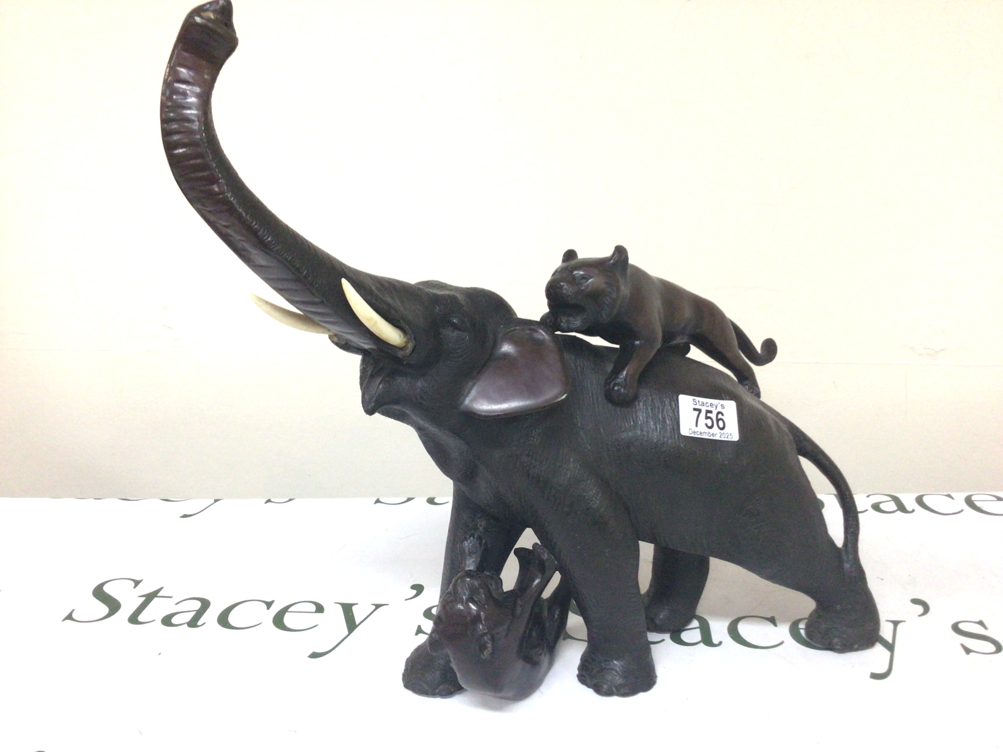 A Japanese late 19th Century bronze of an elephant being attacked by tigers. Hight 40cm