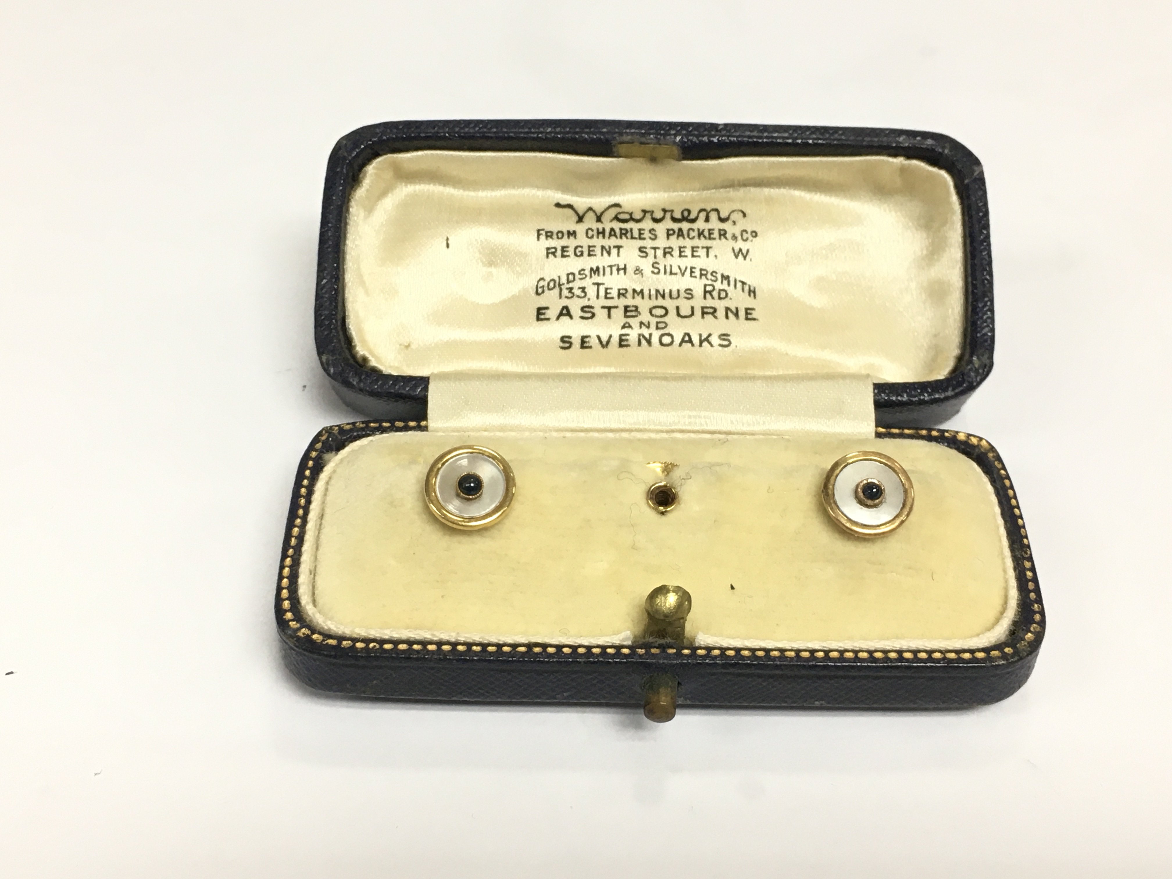 A cased pair of 9ct gold collar studs. Shipping category A.