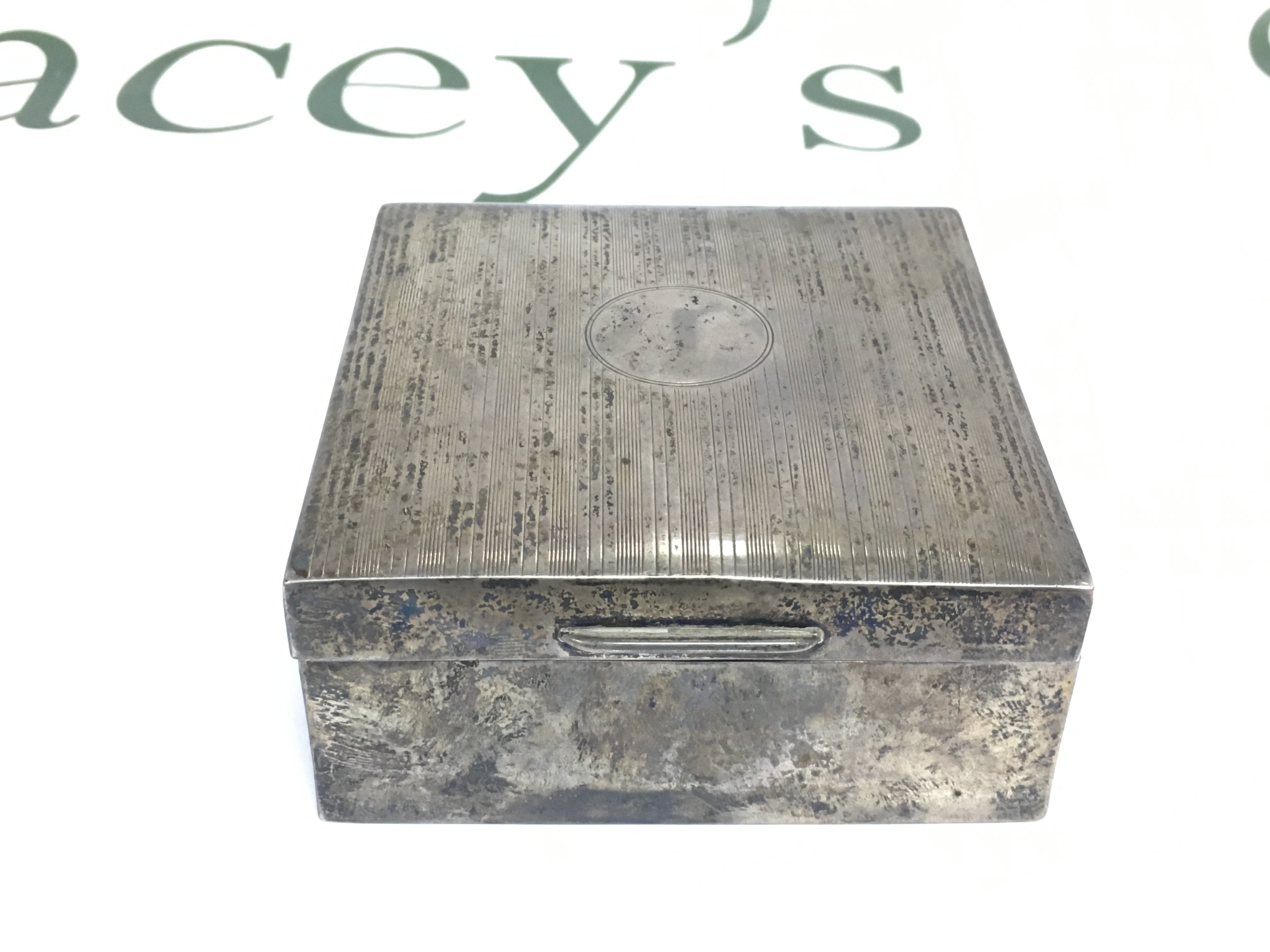 A silver cigarette box, London hallmarks. Shipping category B.