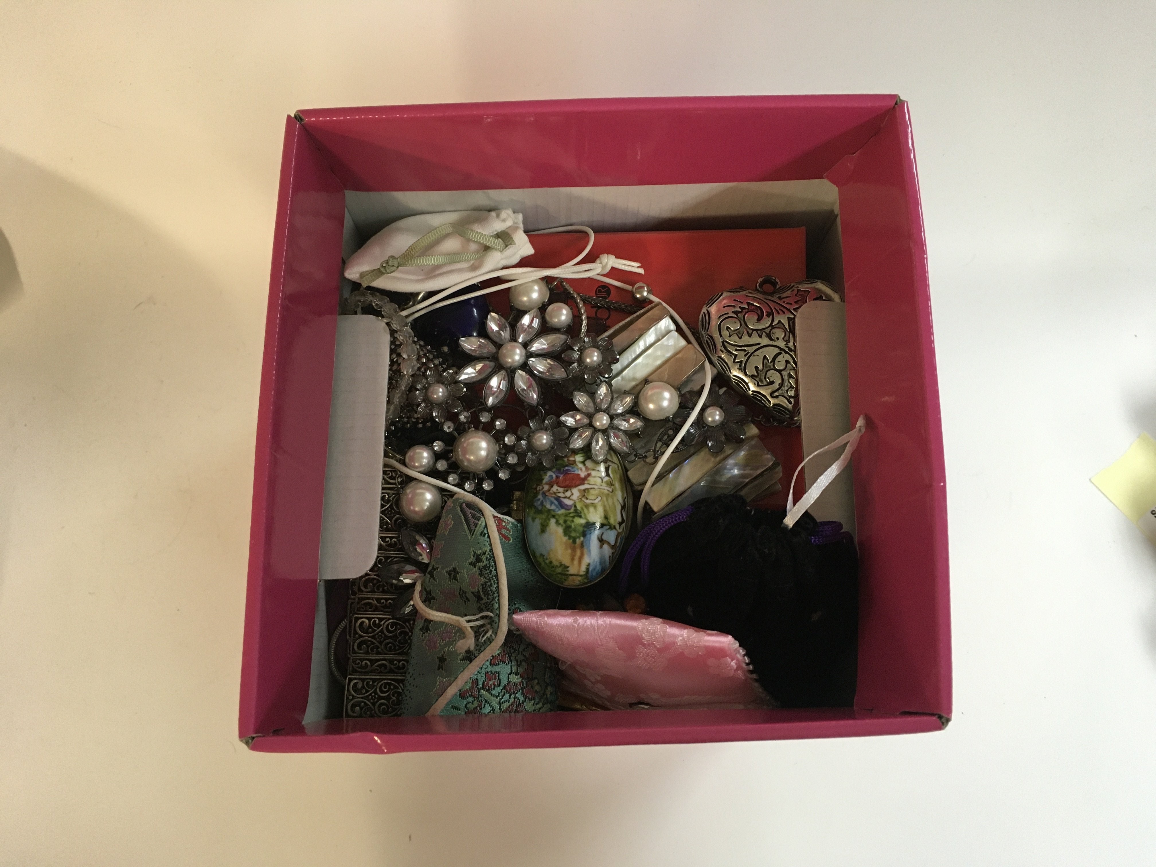 A box of various costume jewellery