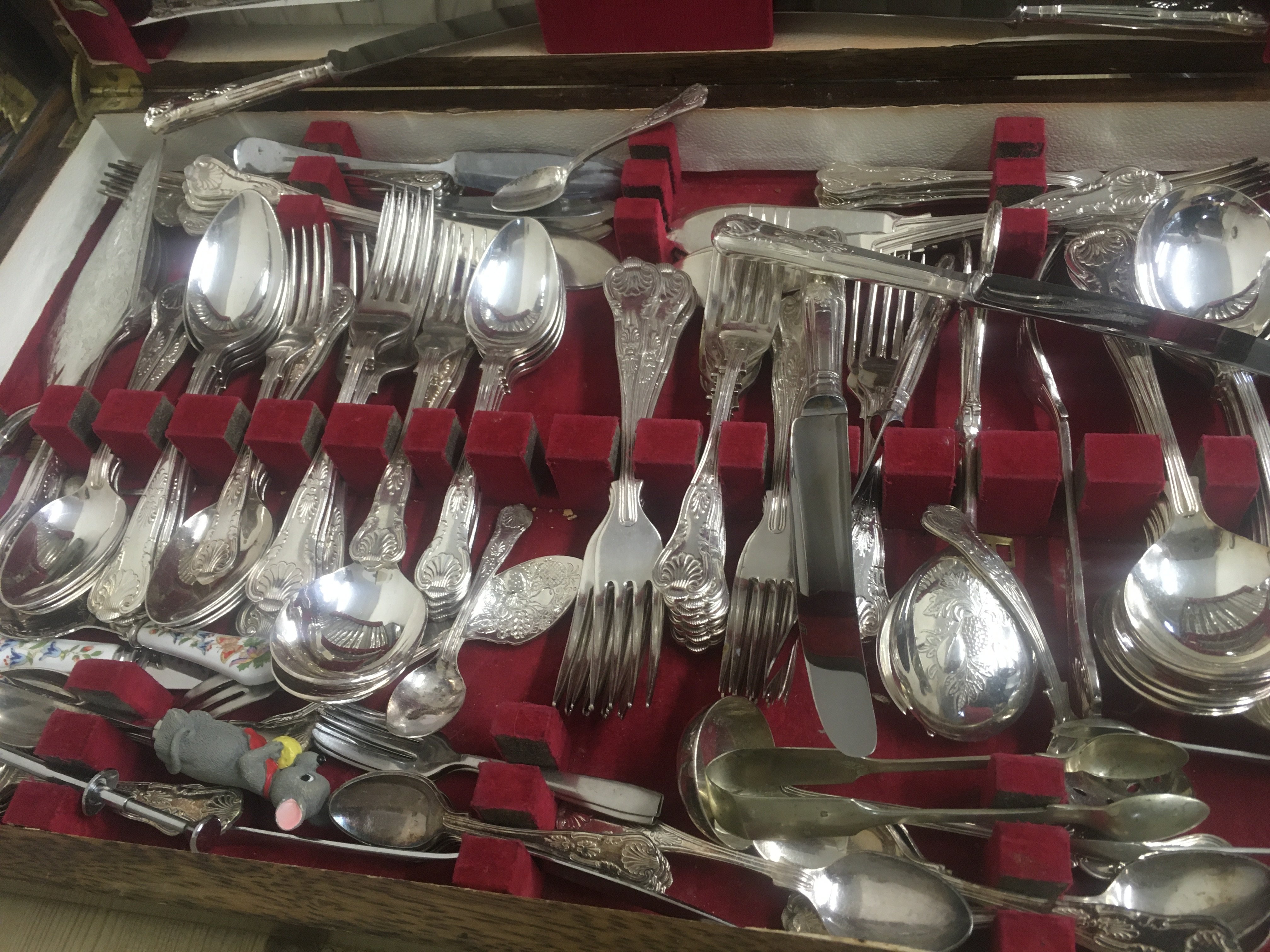 A oak case containing cutlery various .