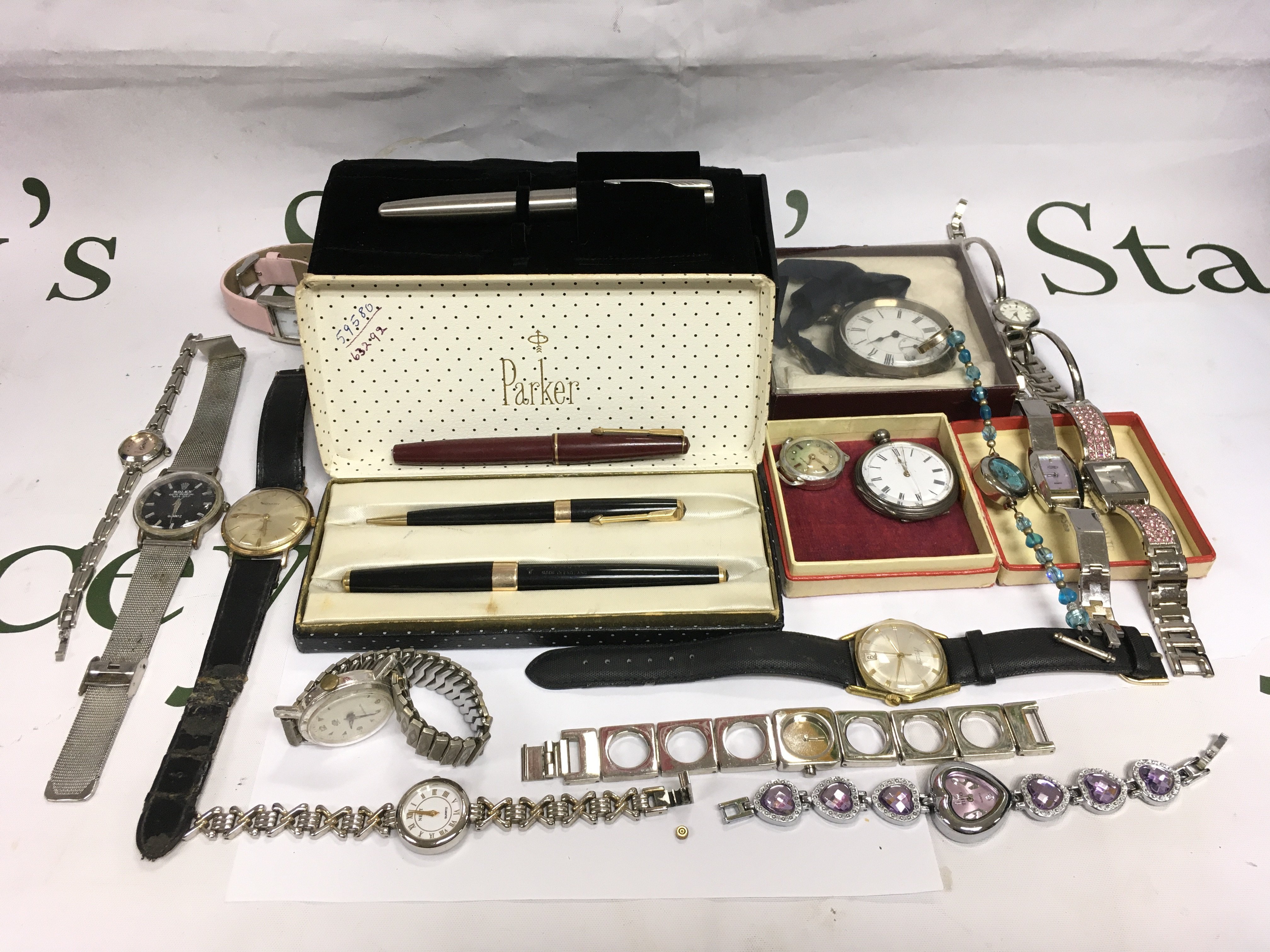 A collection of watches and pens. Shipping category B.