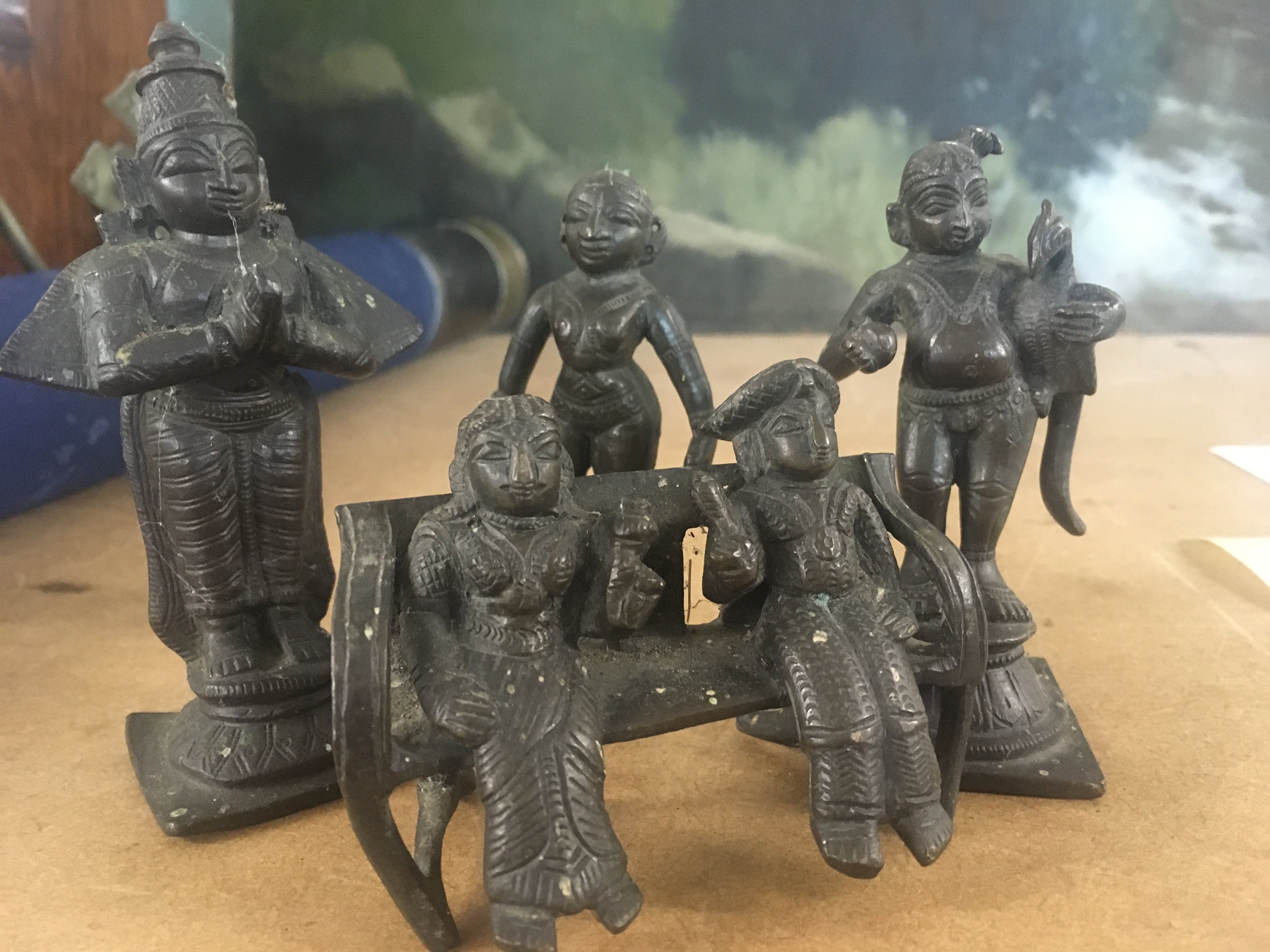 four small bronzed Indian figures. 10 cm