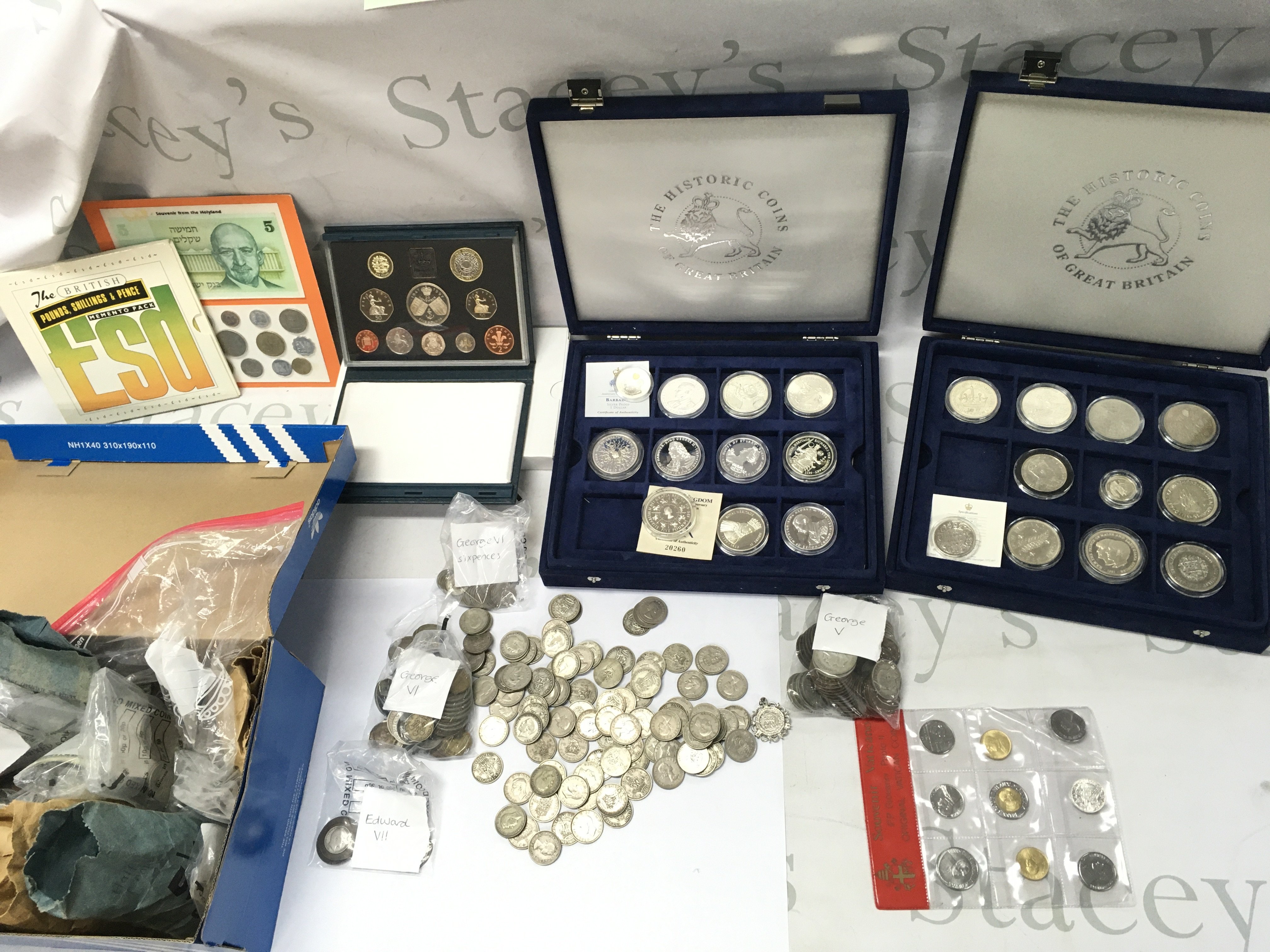A large collection of assorted world coinage including sterling silver commemoration coins and pre 1946 coinage. Postage C