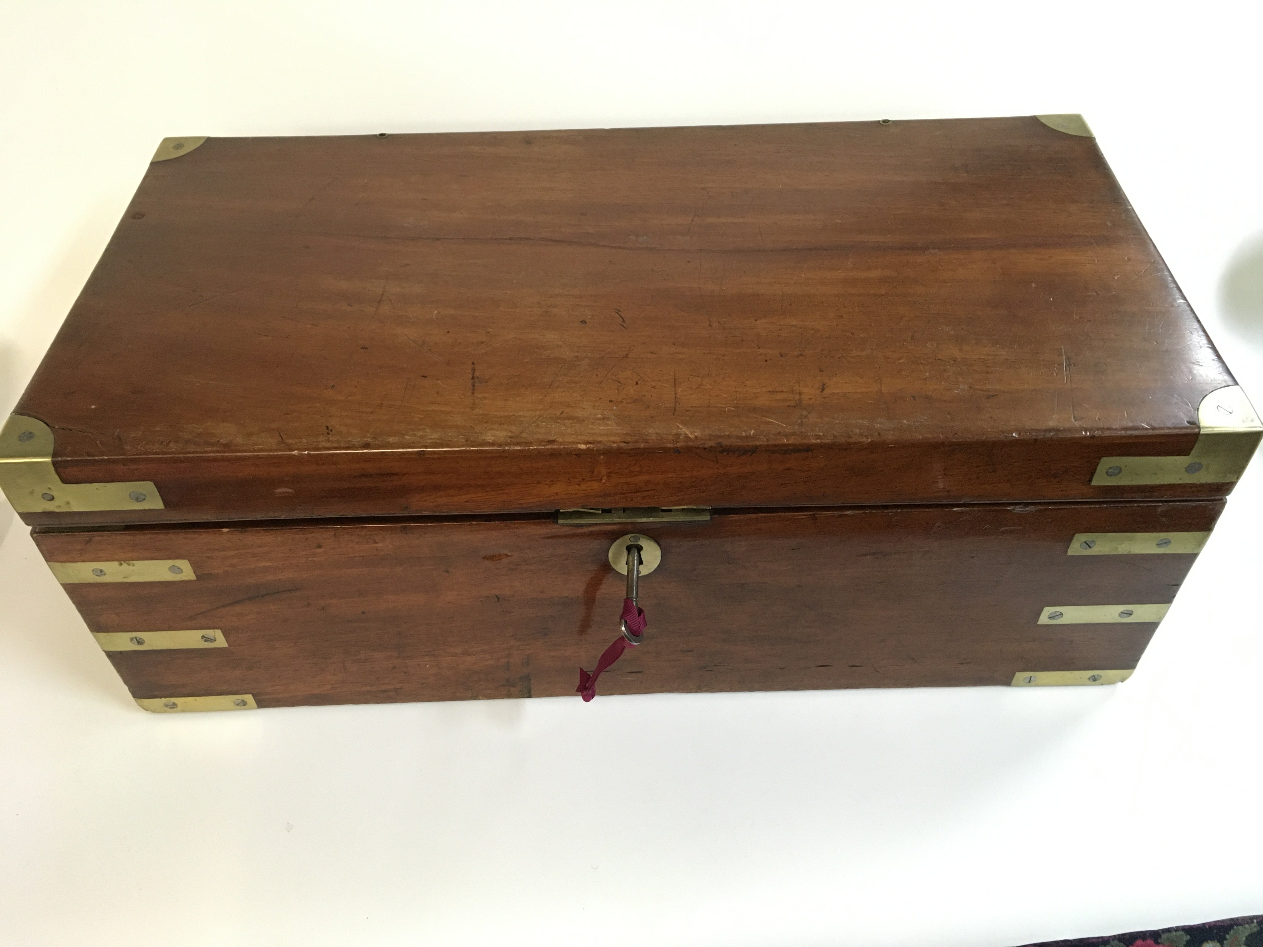 A 19th century mahogany brass board writing box
