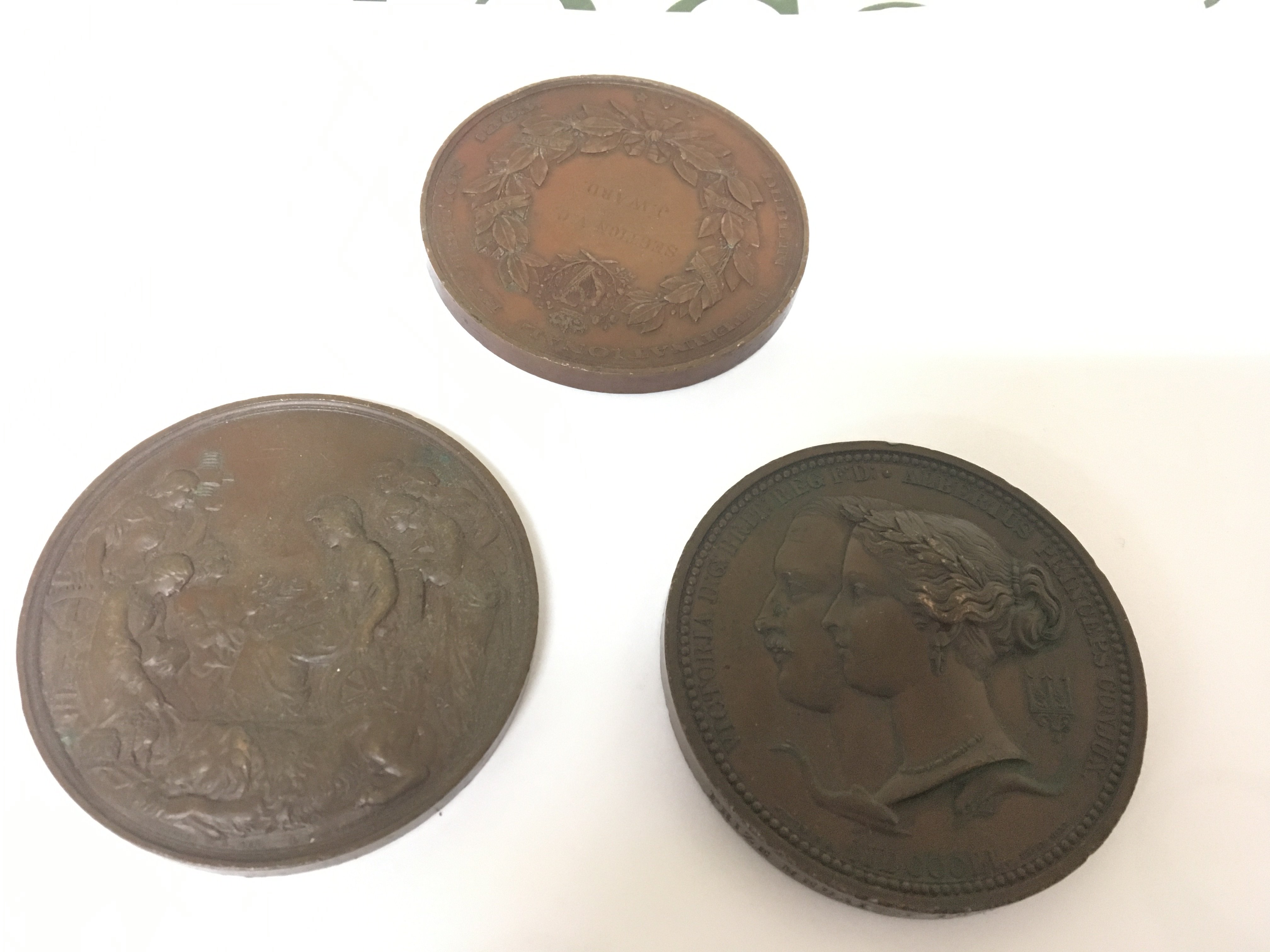Three rare Victorian International Exhibition Bronze cast medals including the 1851 Exhibition class VA awarded to J Ward. Only five medals were awarded in each class.The 1851 International Exhibition was the first world exhibition and the most successful. The medal designed by William Wyon. Chief engraver to the Royal Mint. Also 1862 International medal and Dublin 1865 International medal also awarded to J Ward. (3)
