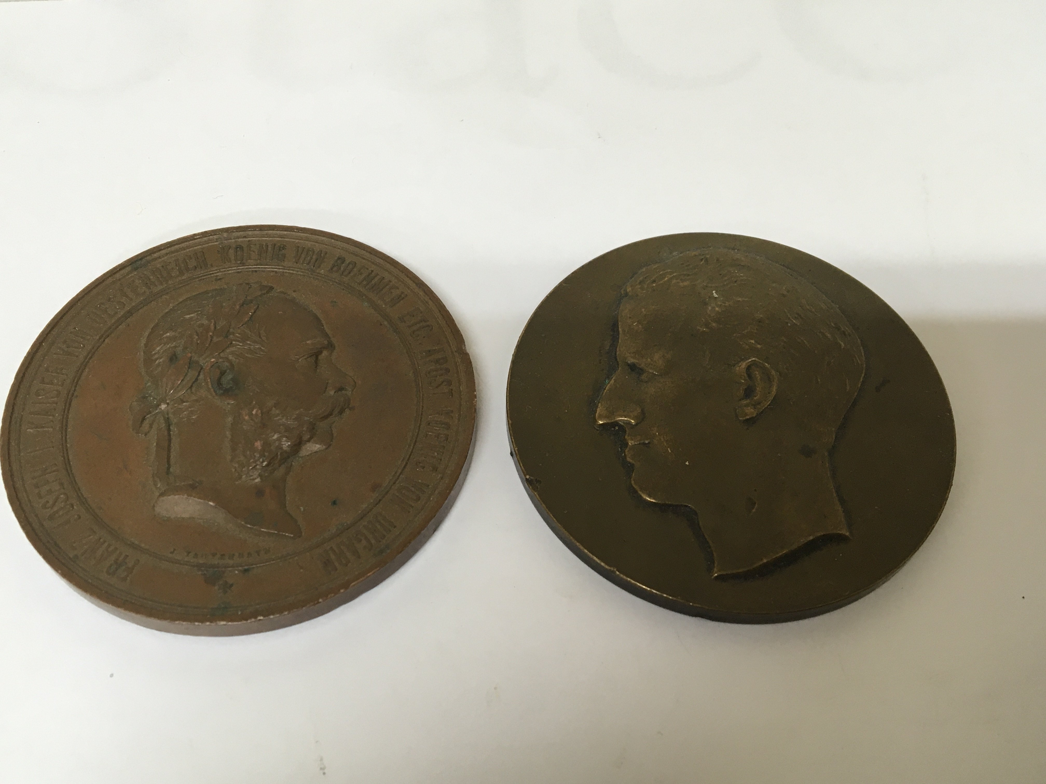 An Austrian Vienna 1873 International Exhibition bronze medal with profile of Emperor Franz Joseph. With one other Belgium bronze medallion (2)