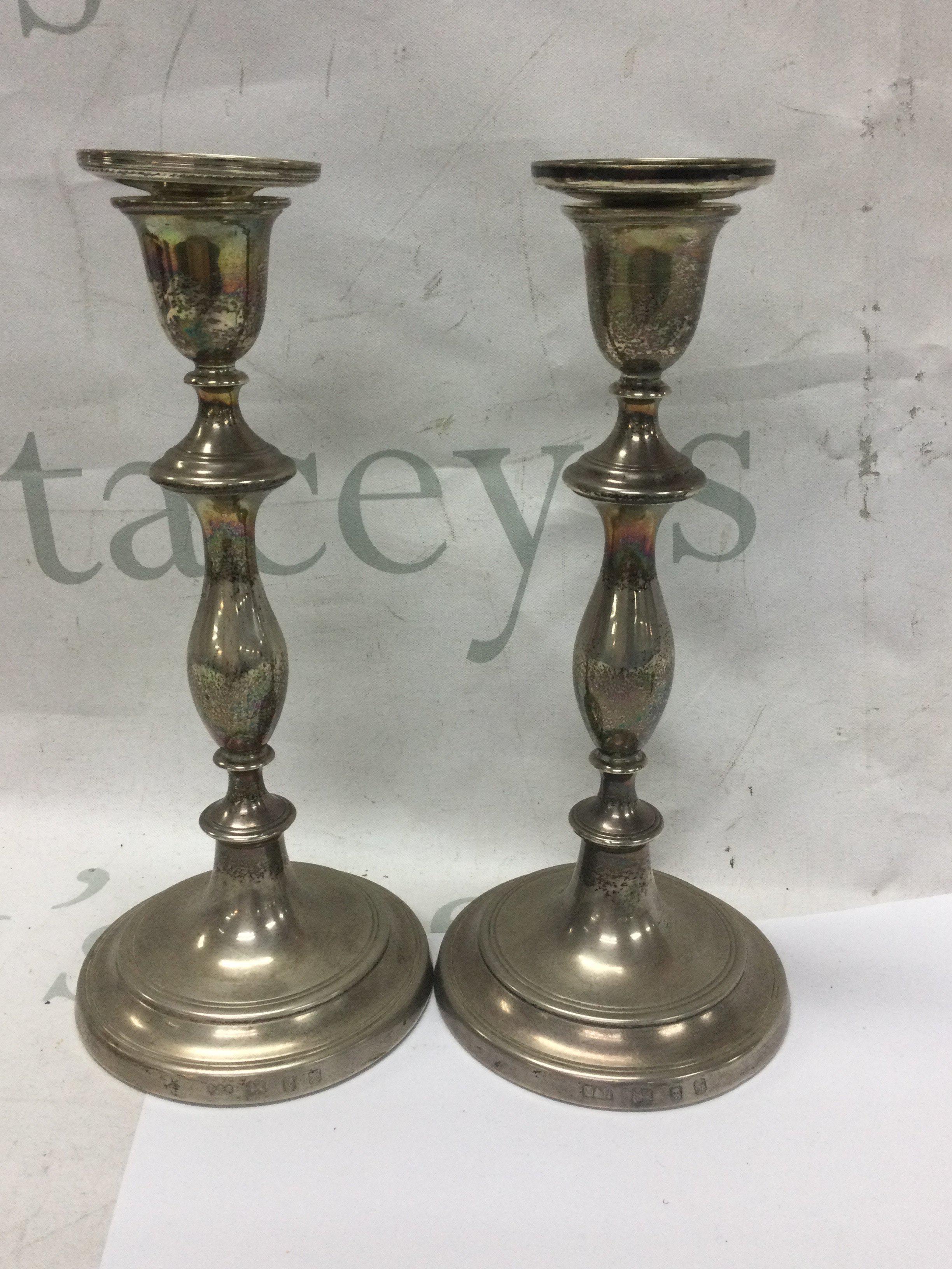 A pair of silver candle sticks London hallmarks.