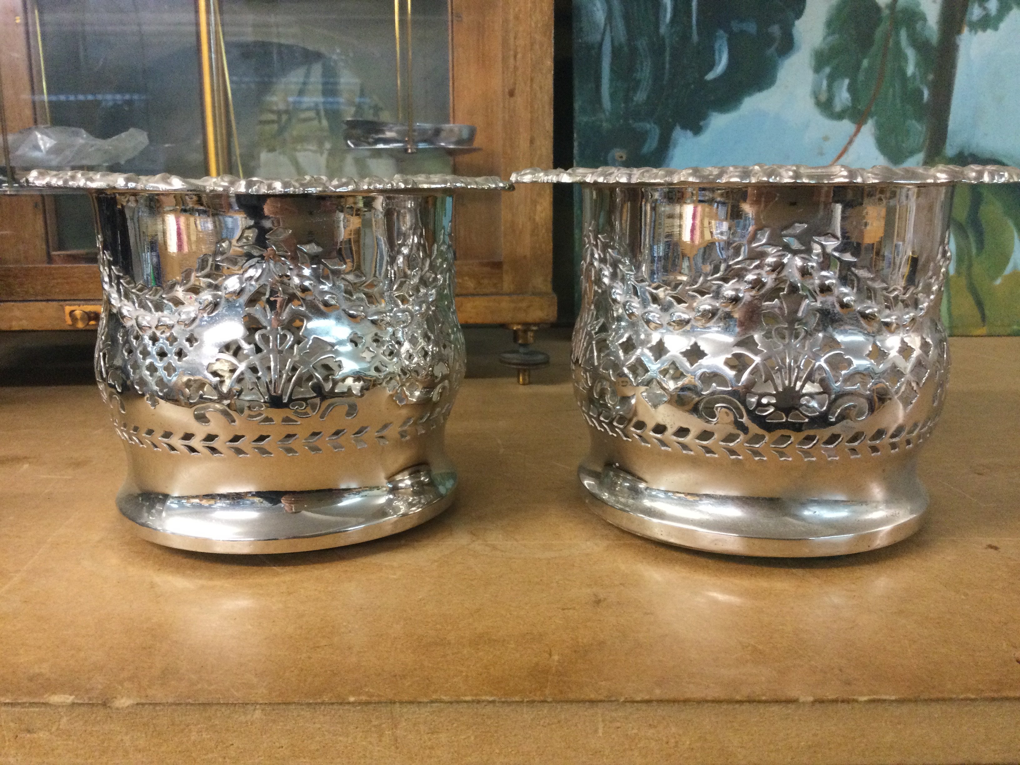A pair of silver plated wine coasters 12 cm .