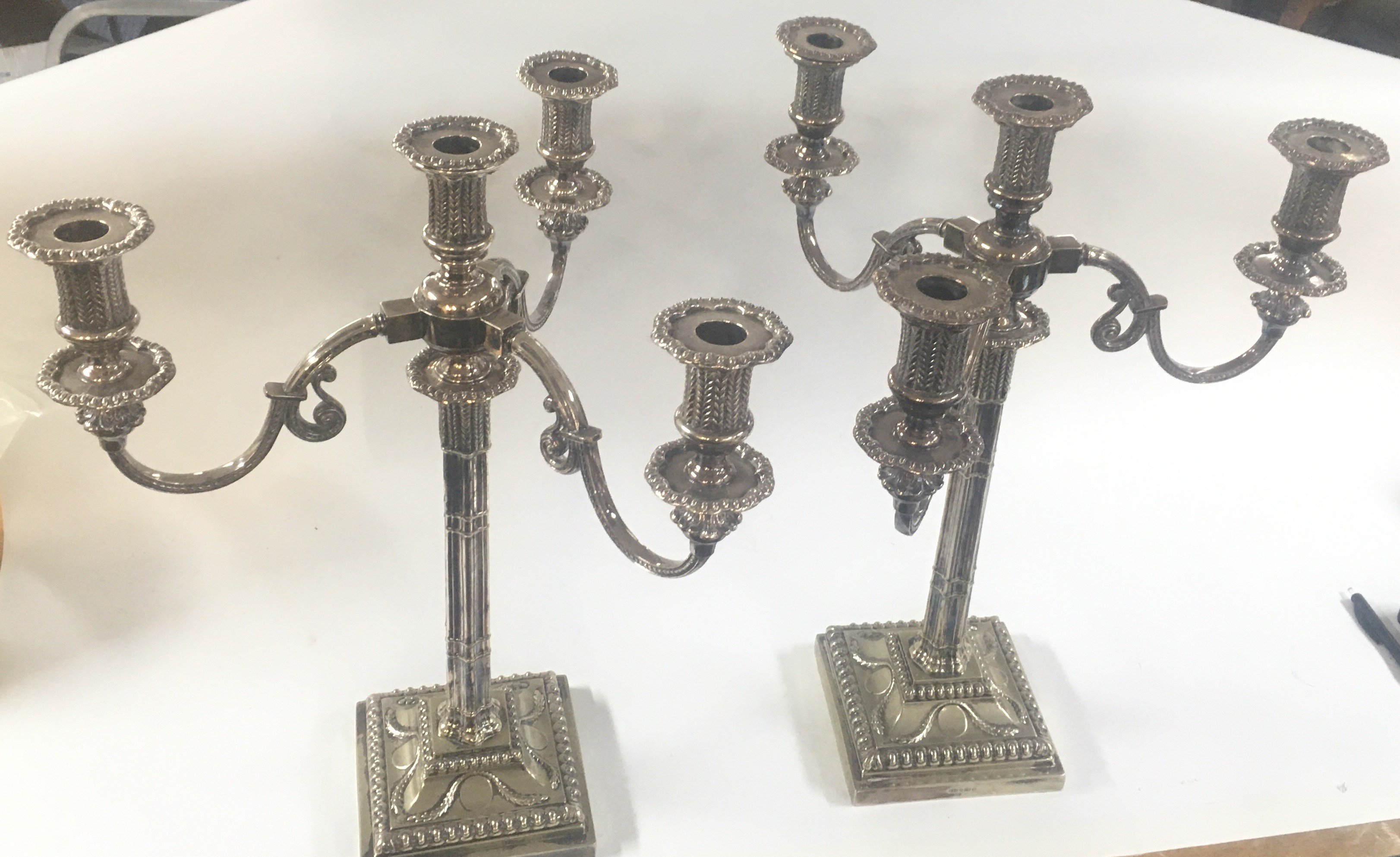 A pair of late 19th century silver plated candelabras , 47cm tall 36cm wide