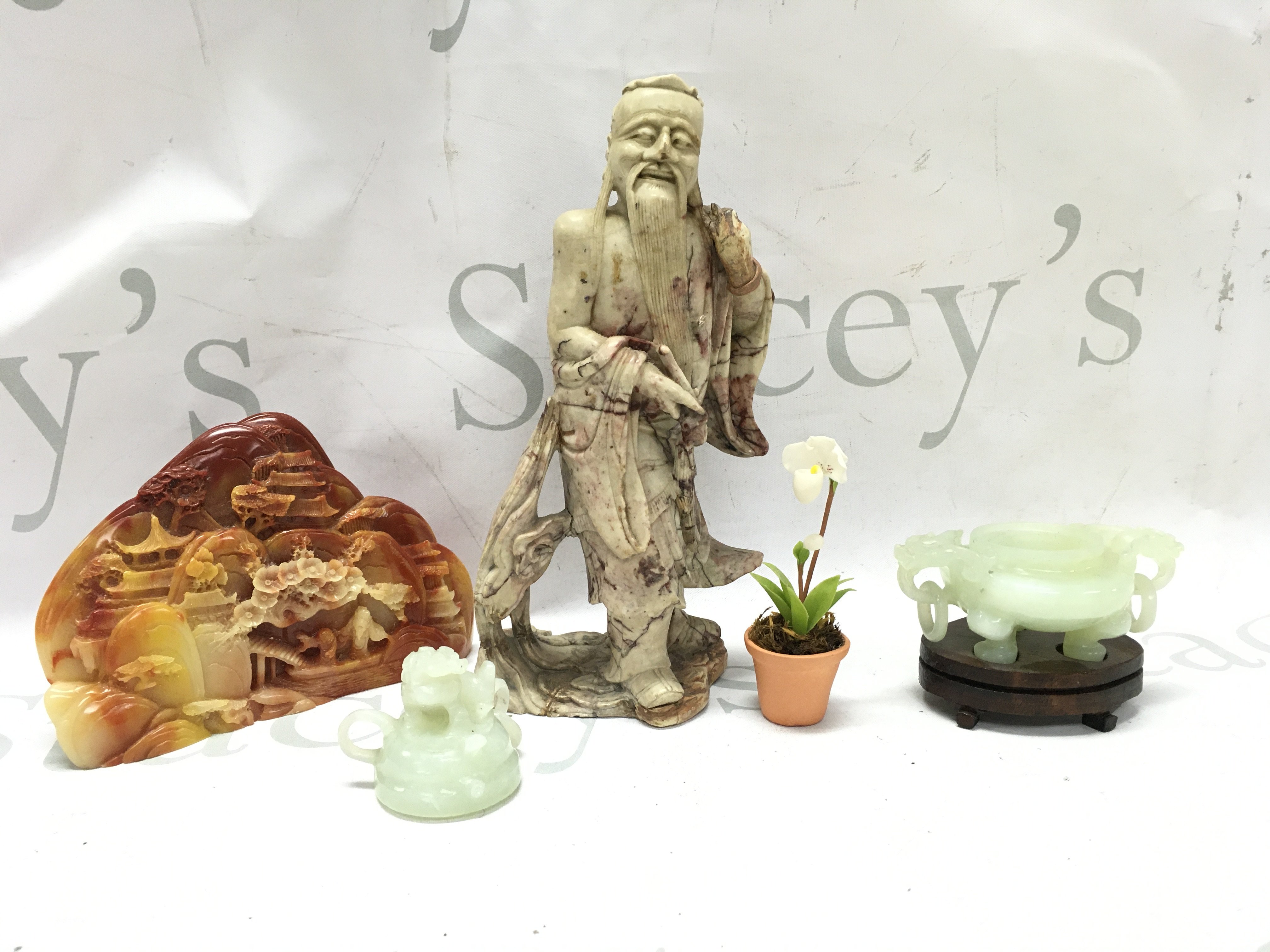 Chinese soapstone carvings including Shou La figure , carving of a temple scene , small artificial orchid plant etc. this lot cannot be posted