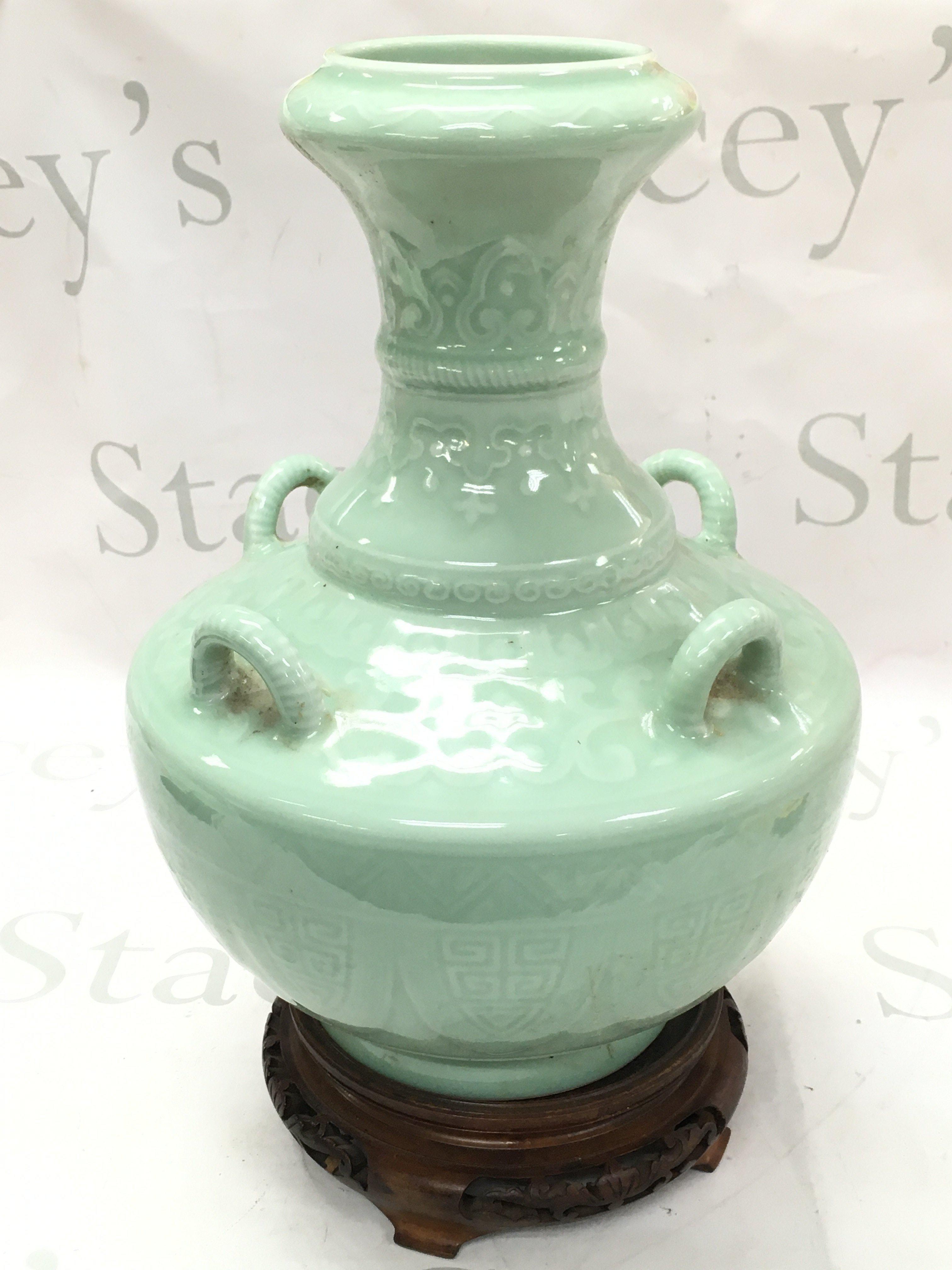 A Chinese Celadon glazed vase , with blue six character mark to base. 31cm tall . This lot cannot be posted