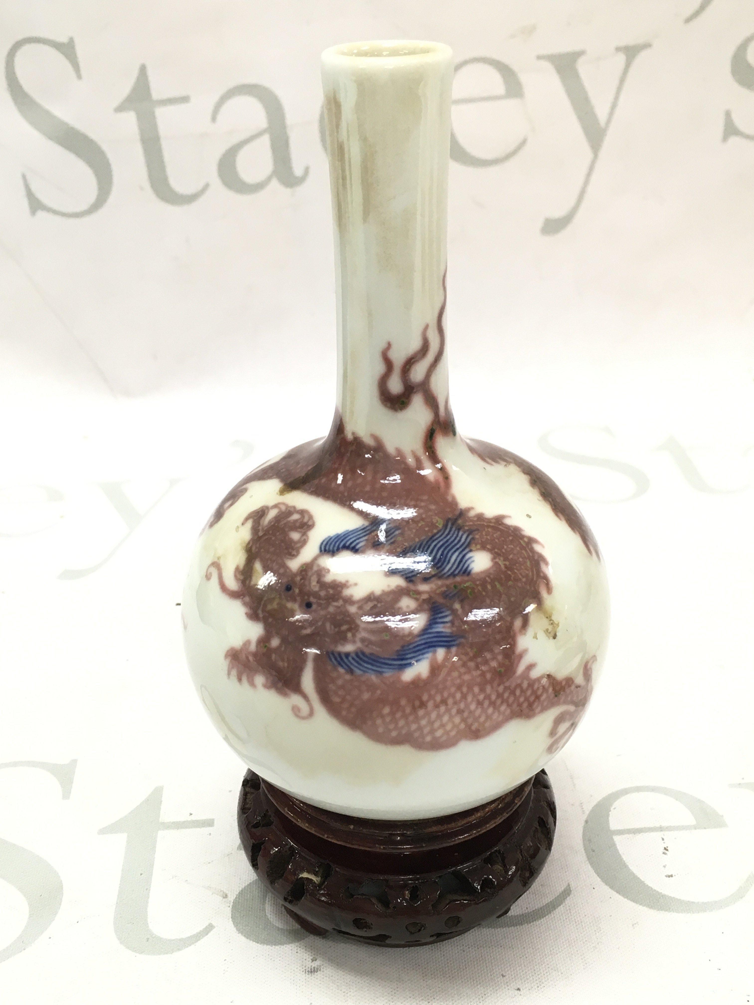 A Chinese dragon vase with a blue six character mark at base. 14cm tall. This lot cannot be posted