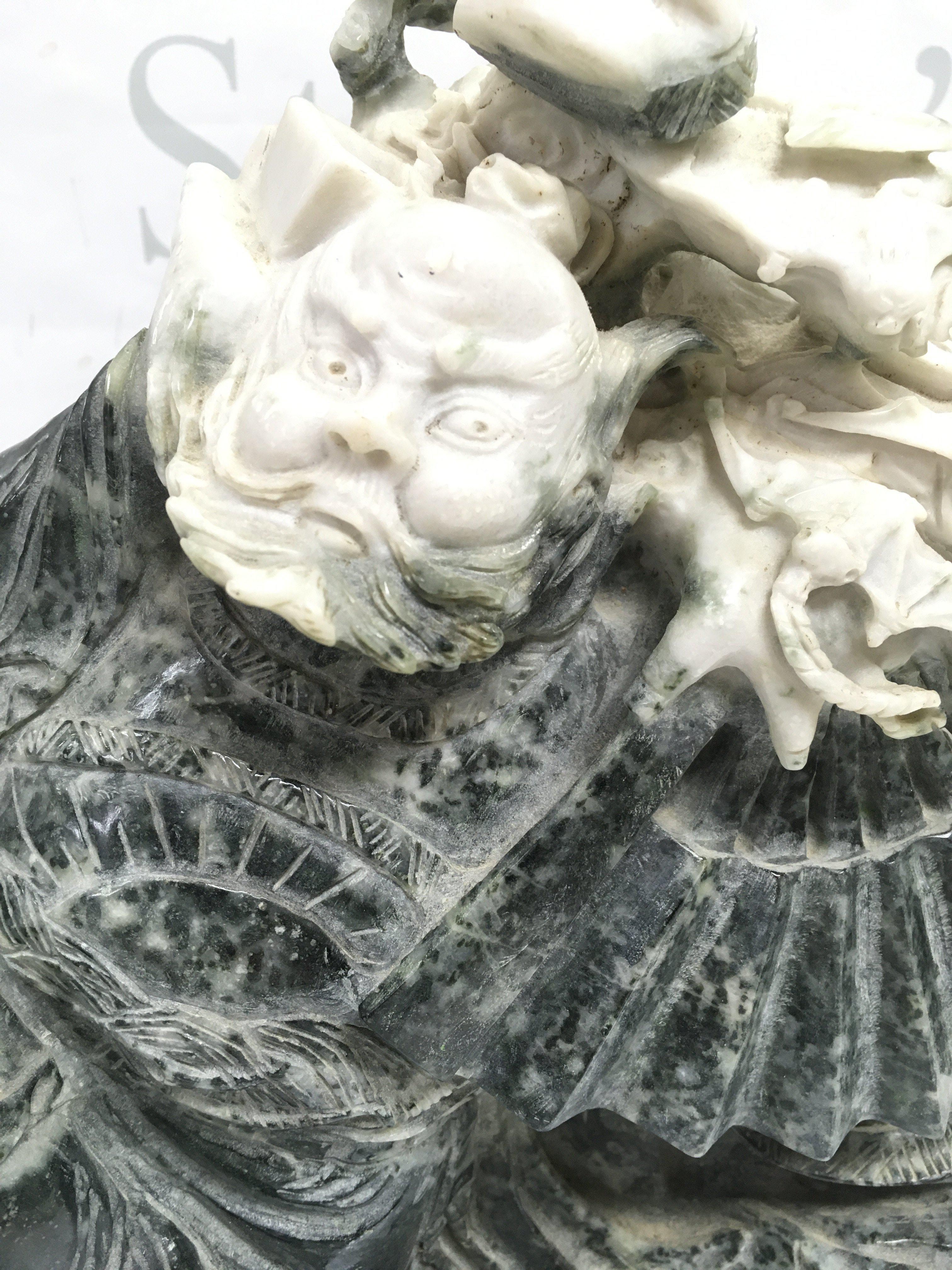 A Large Jade Guardian figure ,34 cm tall 28cm wide. This lot cannot be posted