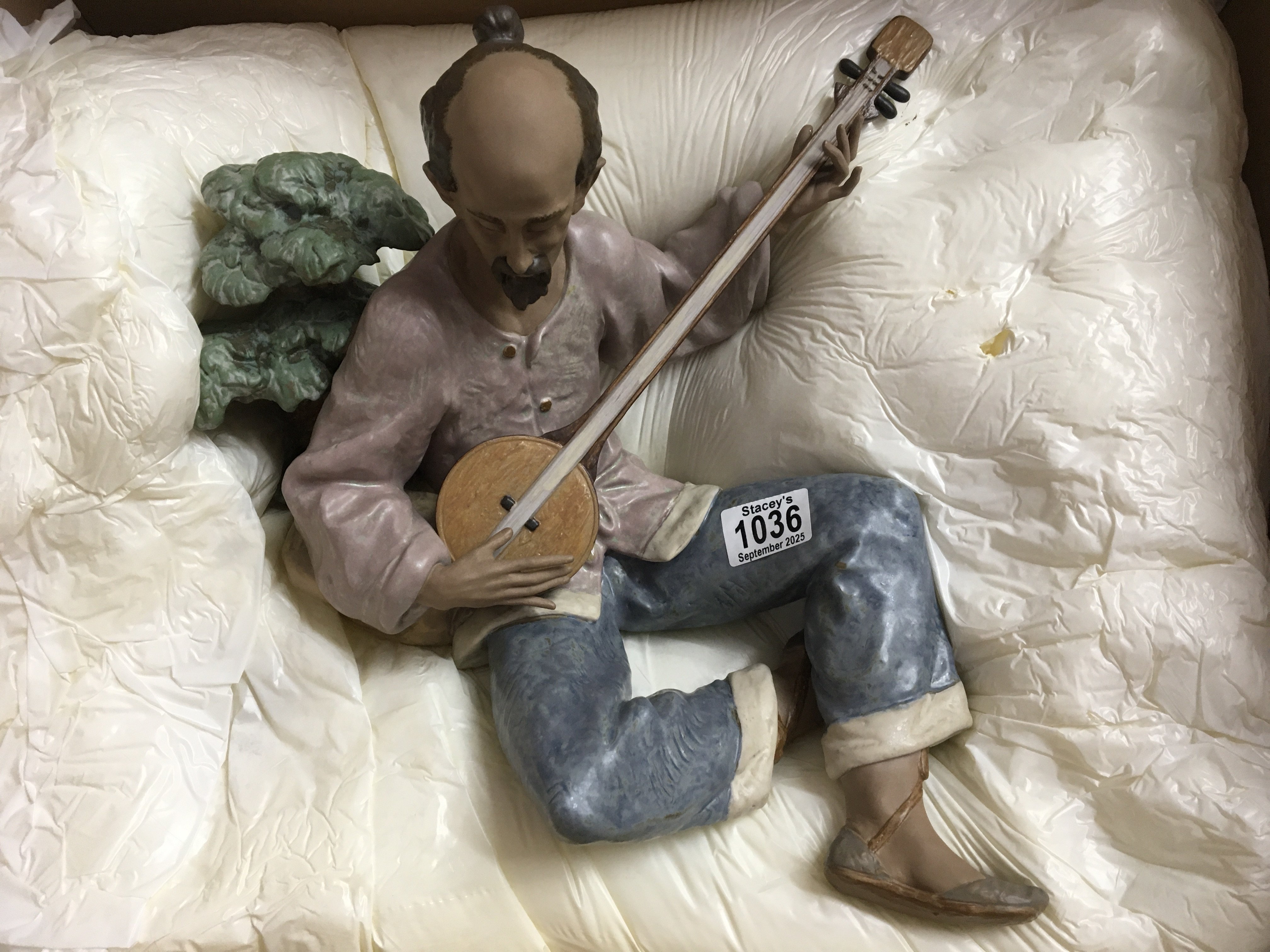 WITHDRAWN - A large boxed Lladro figure of an oriental gentleman playing an instrument. 38cm in height approximately. No obvious damage or restoration
